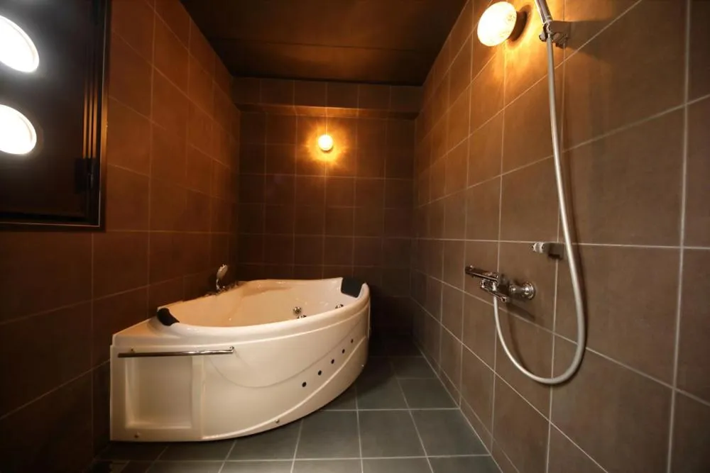 Shower in Terrace Garden Mihama Resort by Coldio Premium