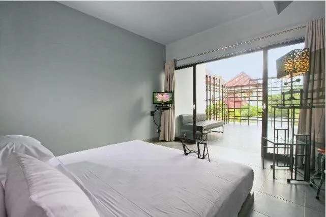 Bed in The Grey Boutique Inn