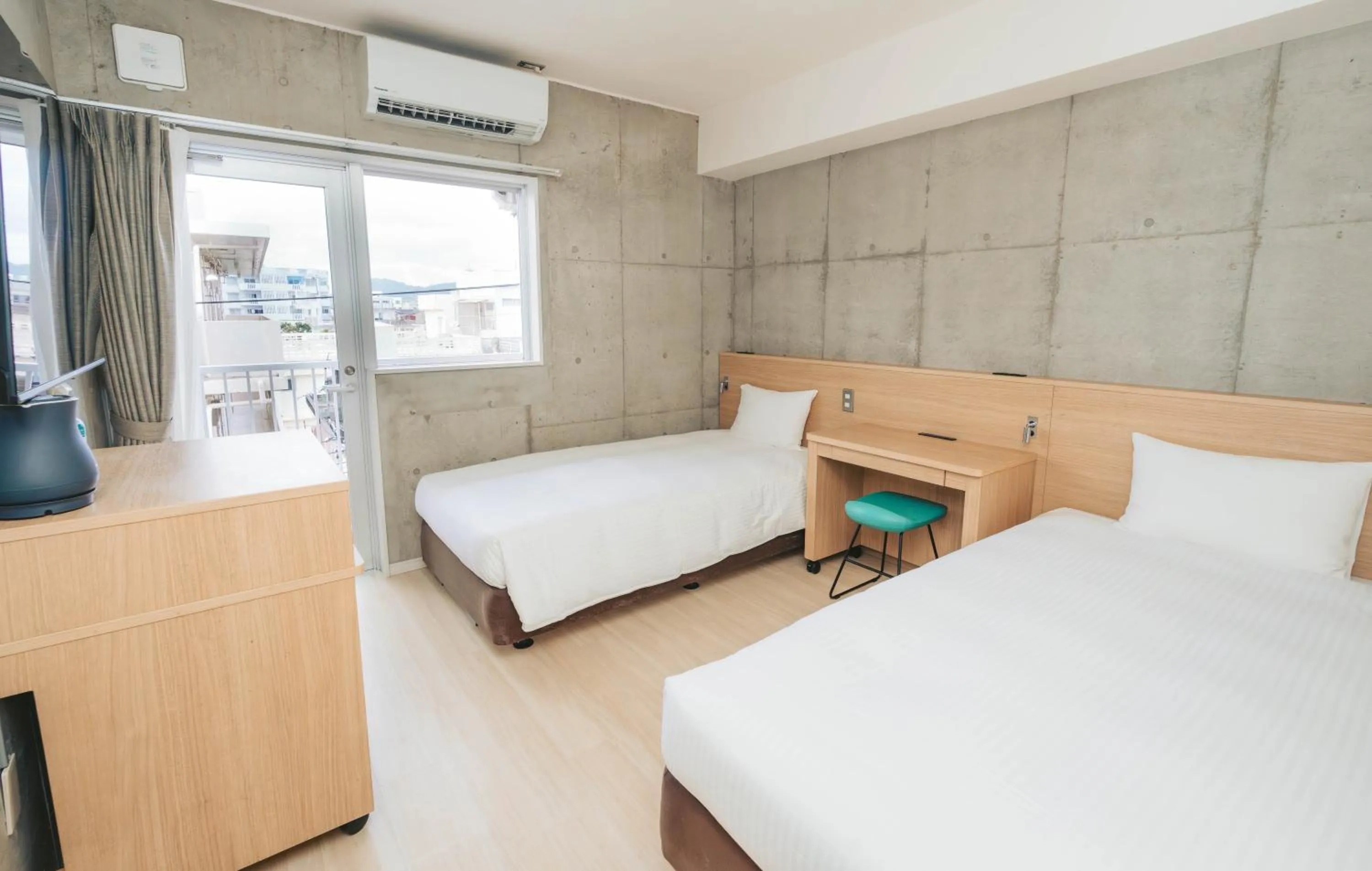 Photo of the whole room, Bed in The BREAKFAST HOTEL MARCHE Ishigaki Island