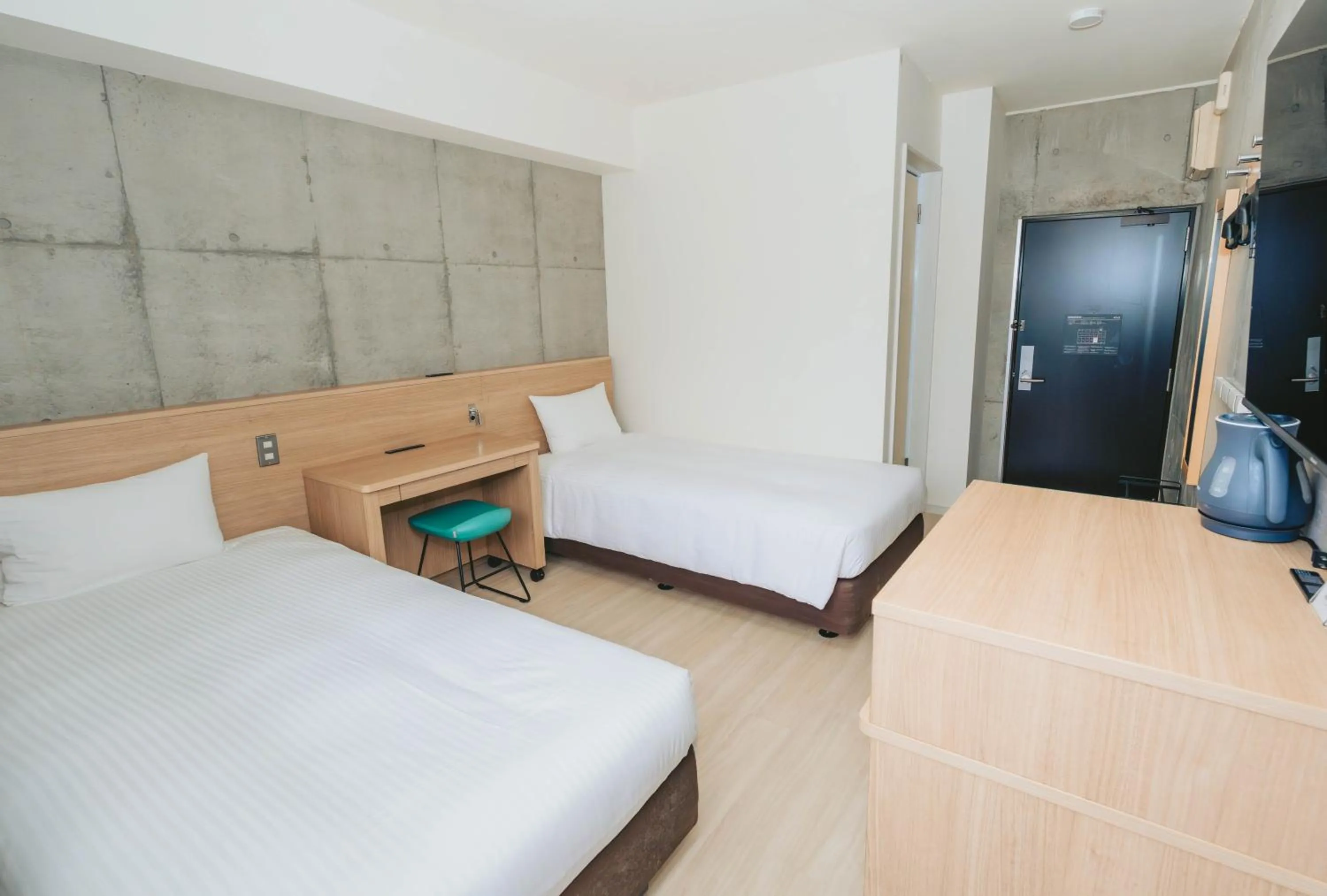 Photo of the whole room, Bed in The BREAKFAST HOTEL MARCHE Ishigaki Island