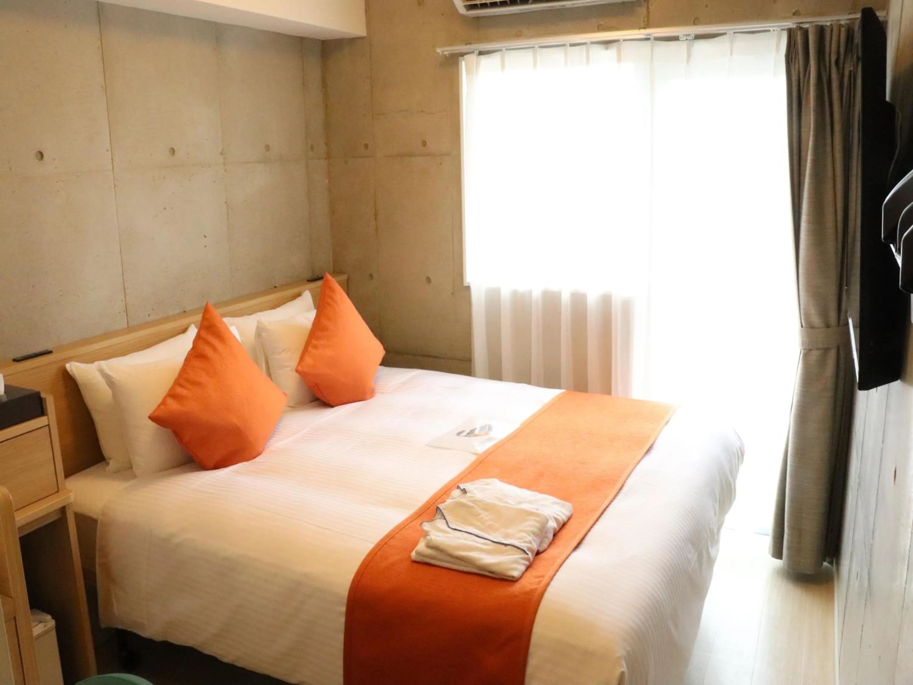 Photo of the whole room, Bed in The BREAKFAST HOTEL MARCHE Ishigaki Island