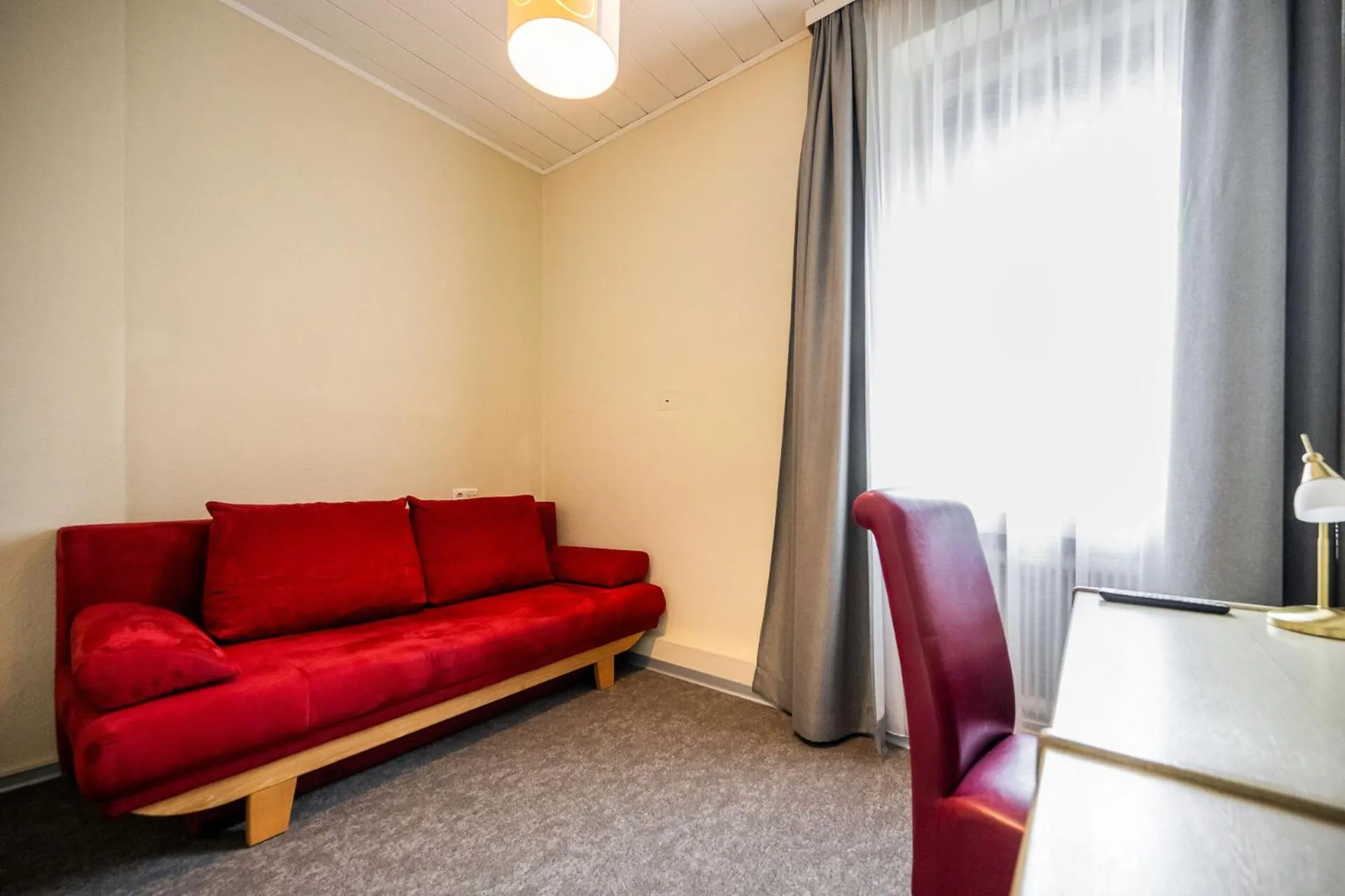 Living room in Motel Zeltweg - Self-Check-in