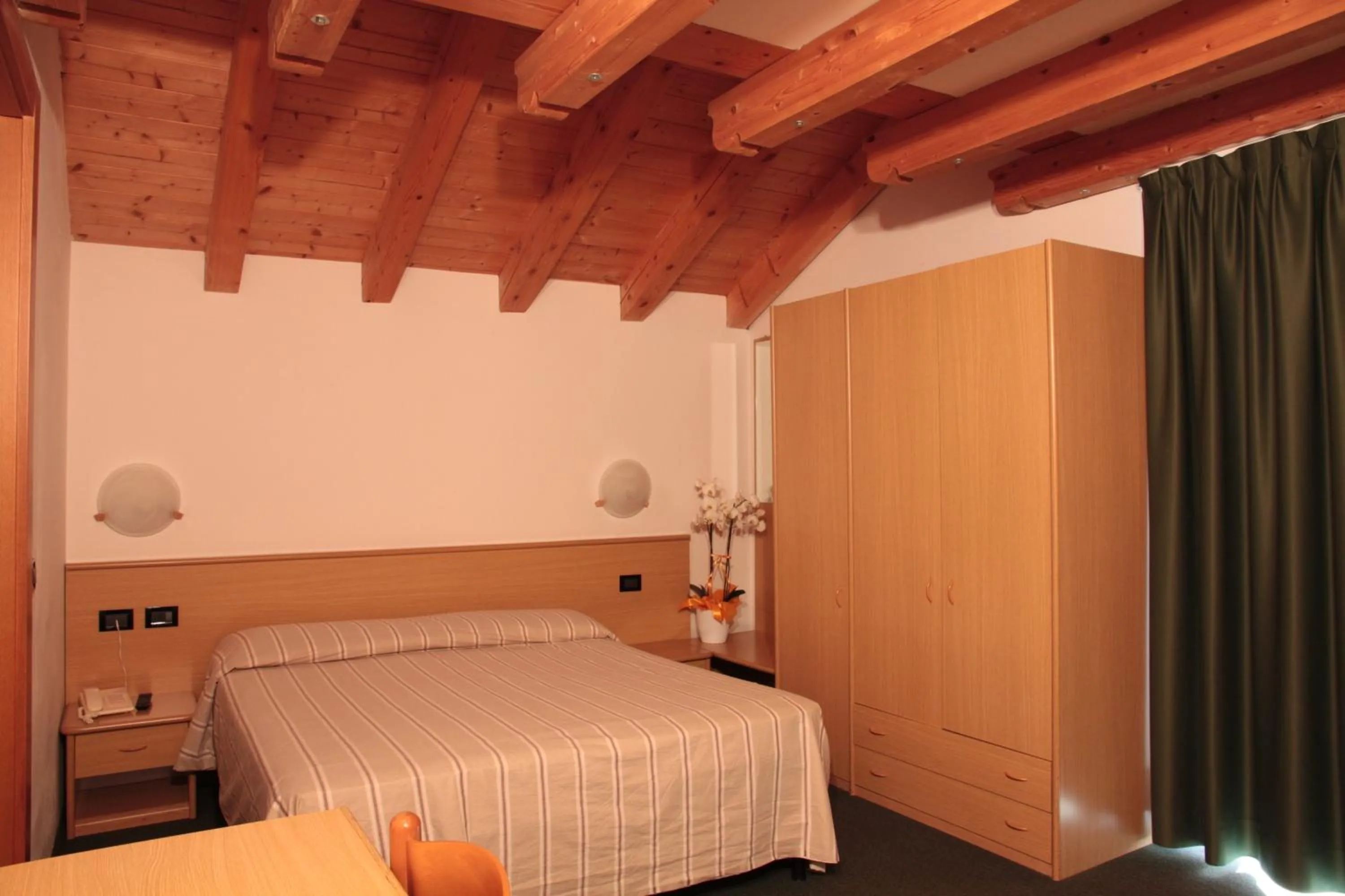 Bed in Albergo Miramonti
