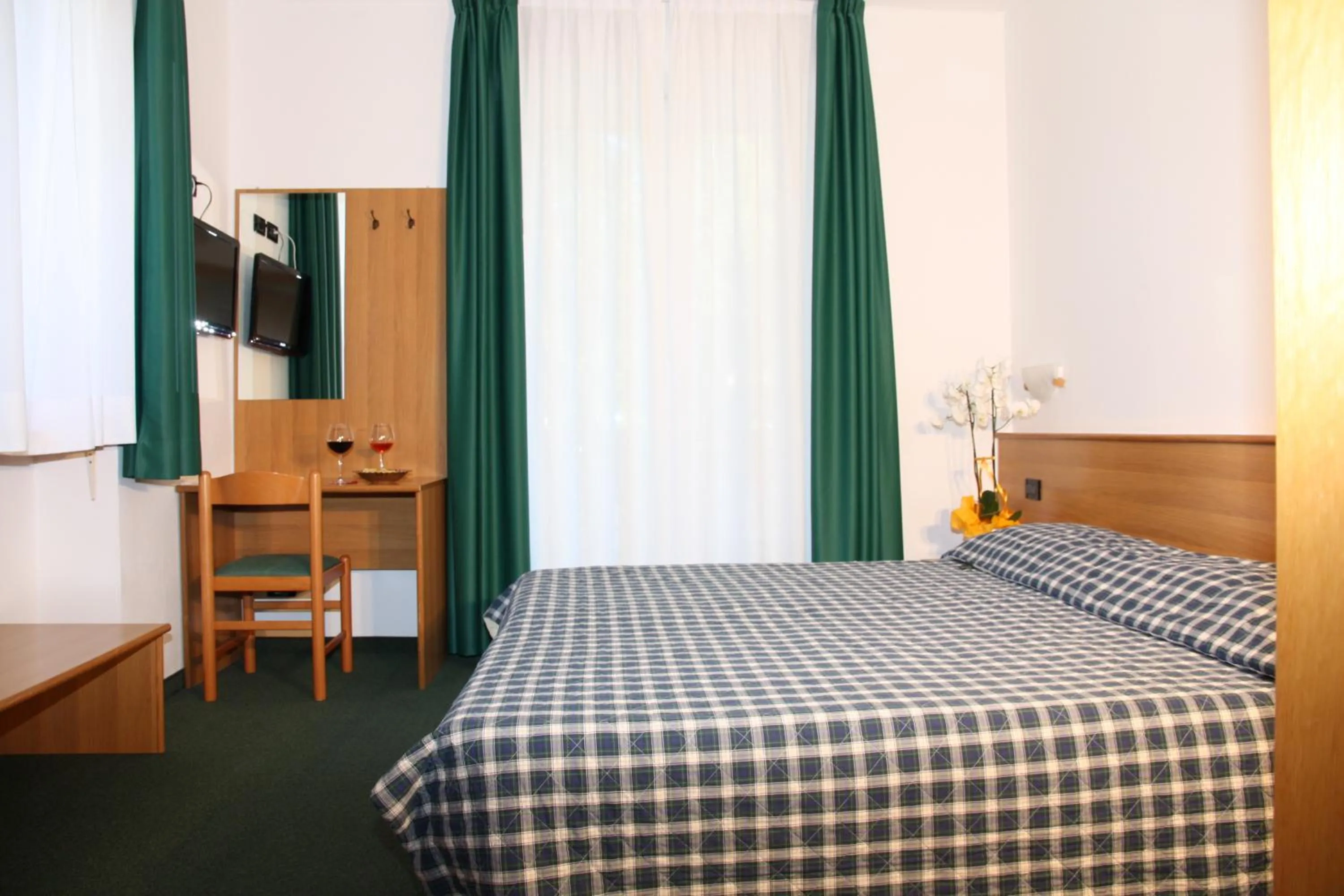 Bed in Albergo Miramonti