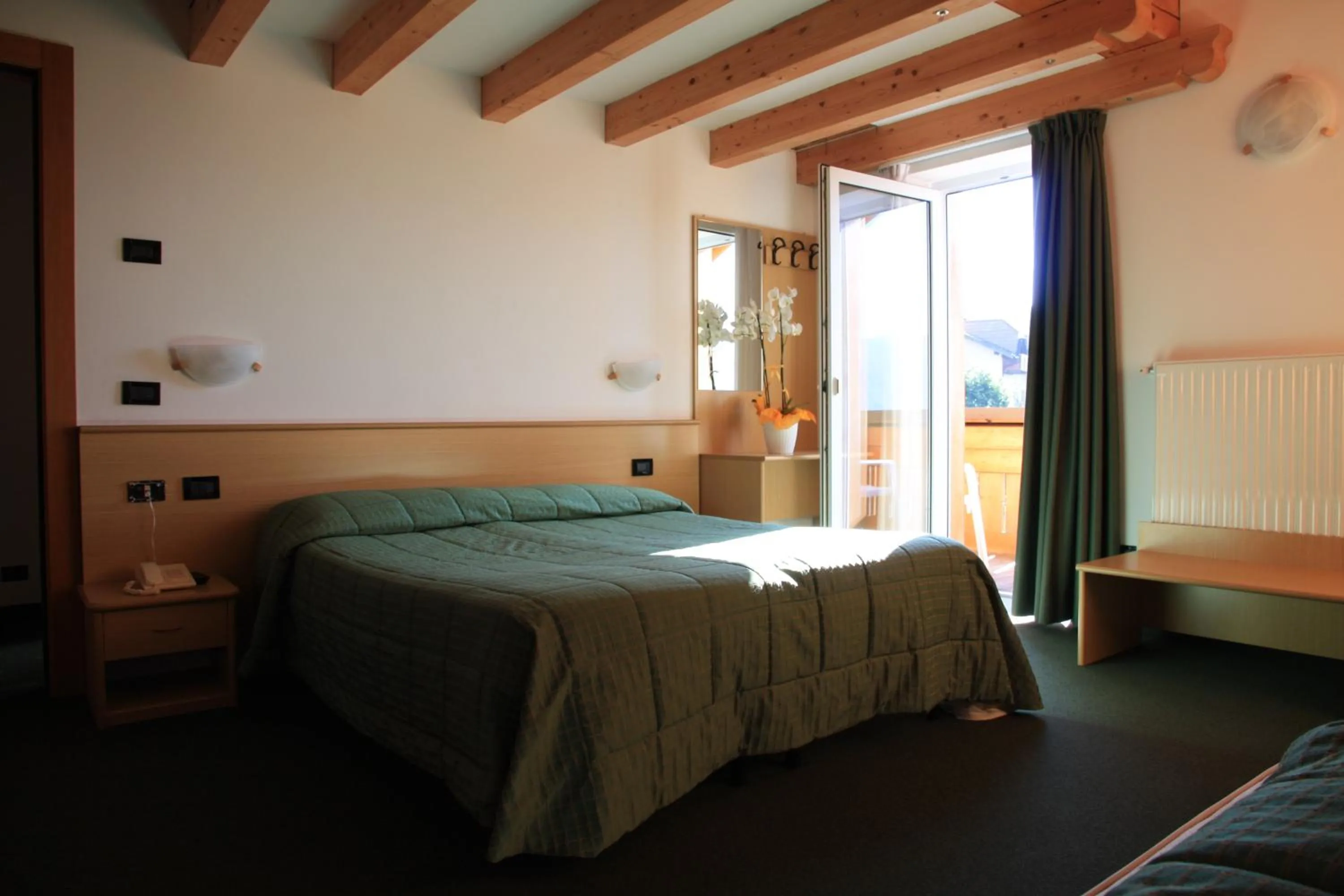 Bed in Albergo Miramonti