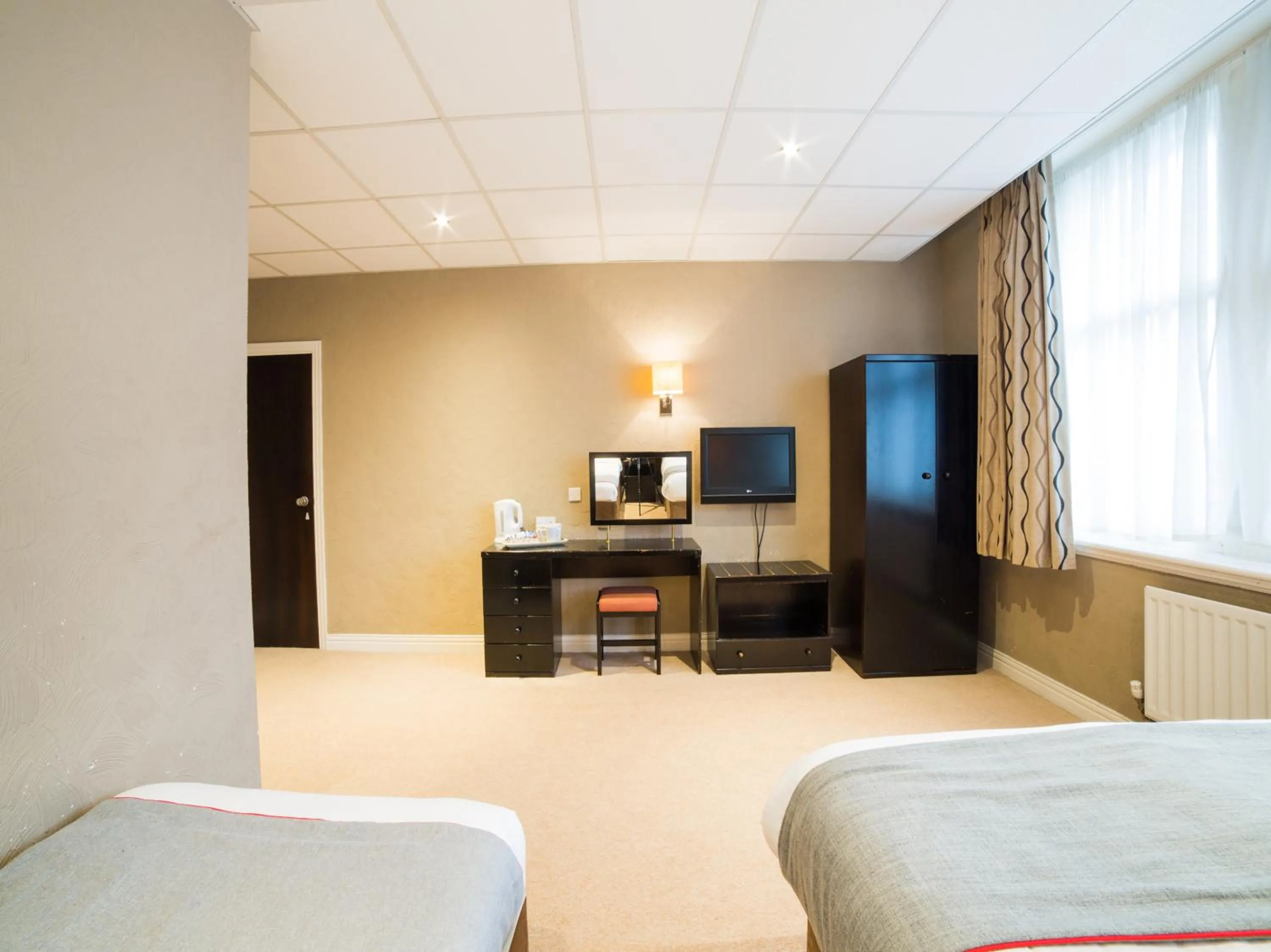 Photo of the whole room, TV/Entertainment Center in OYO Hotel Majestic