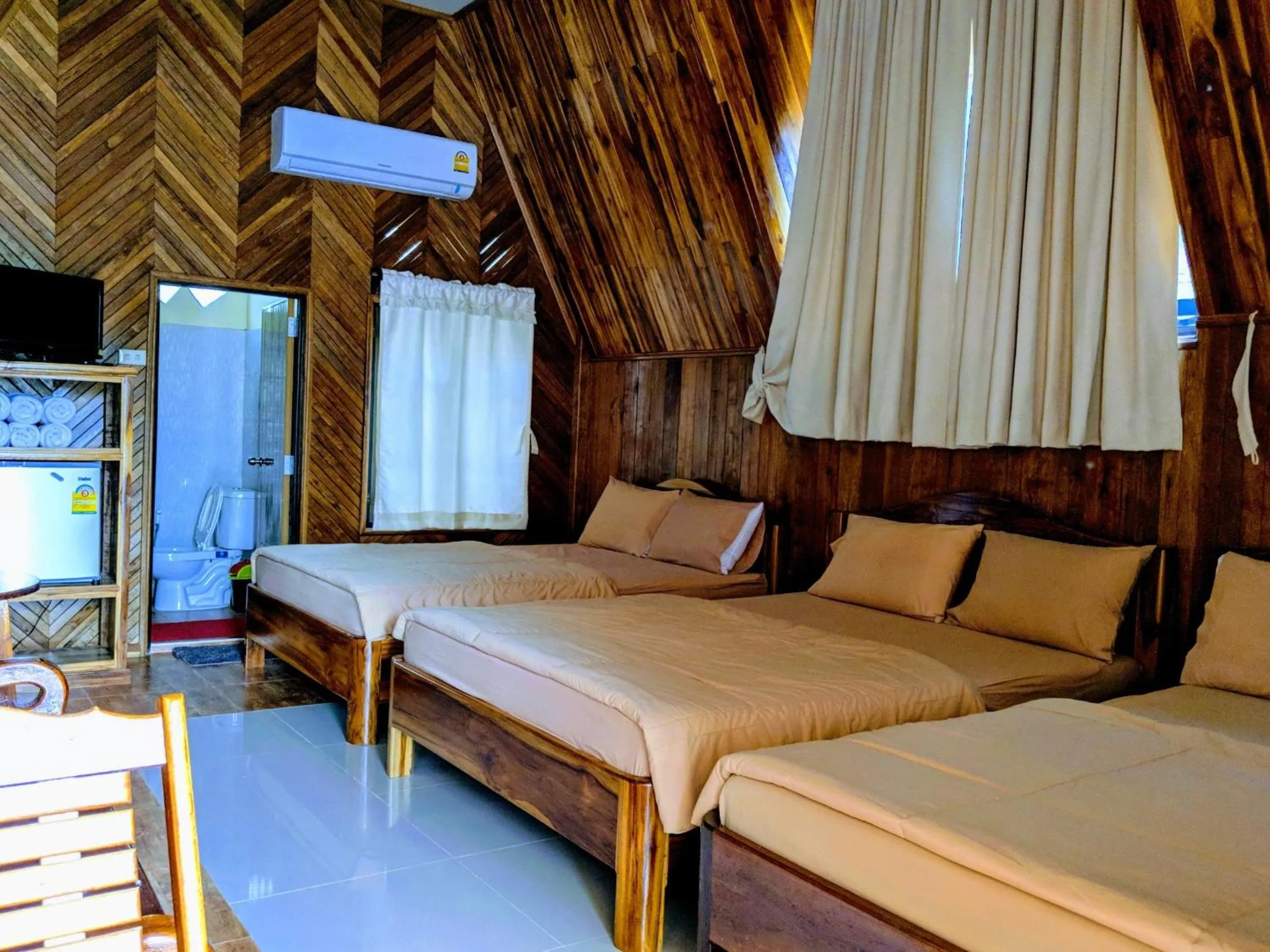 Bed in Bansuanphuhong Resort