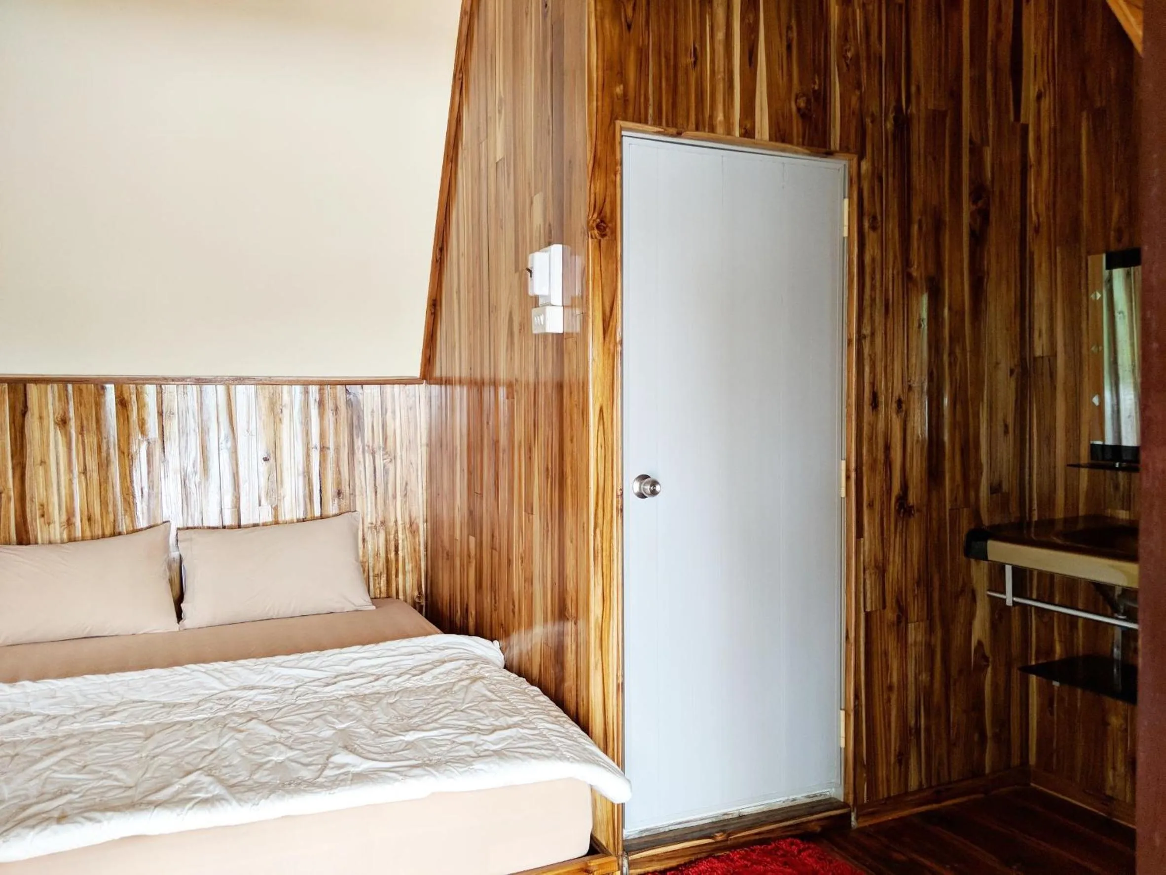 Bed in Bansuanphuhong Resort