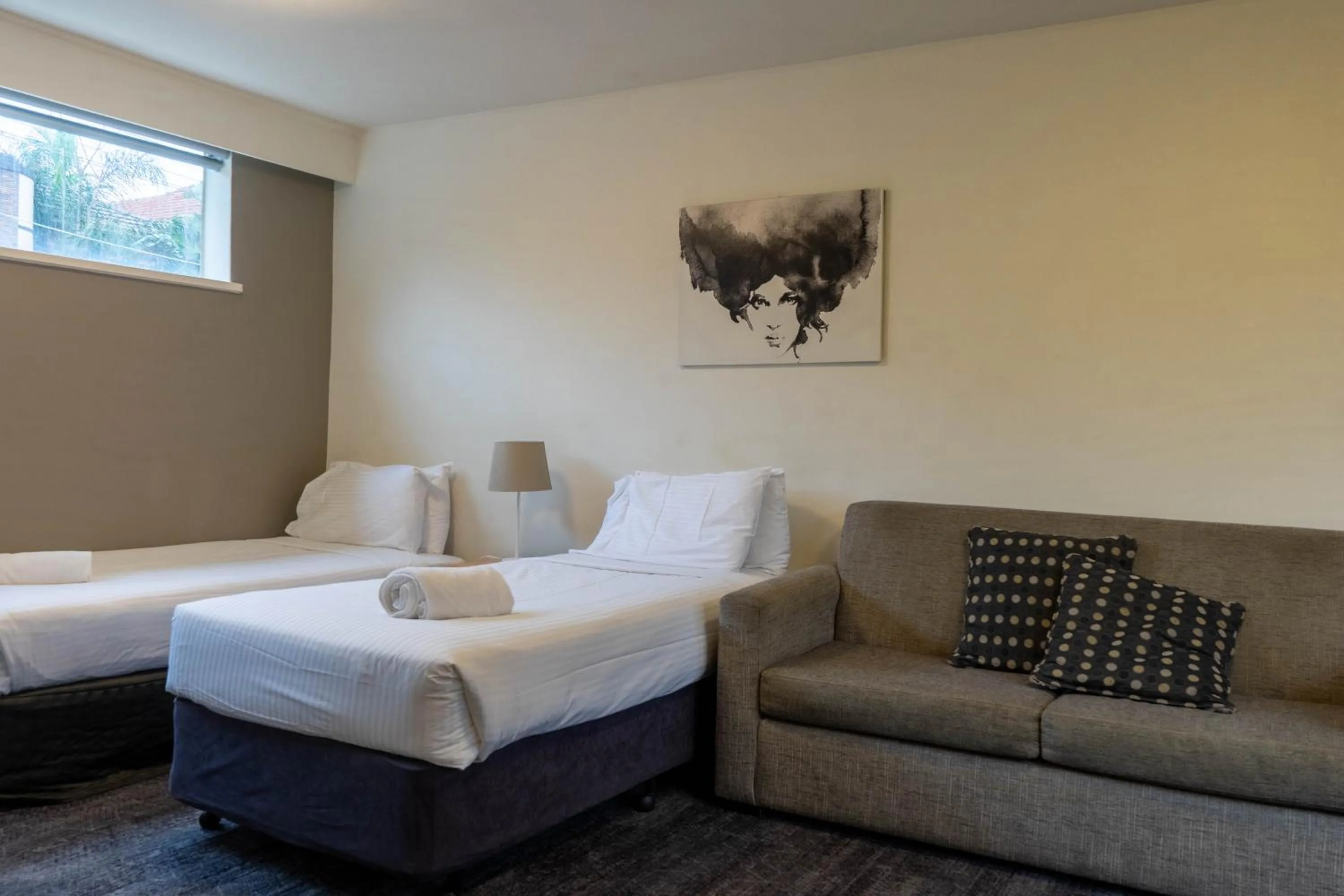 Bed in Cosmopolitan Hotel and Apartments