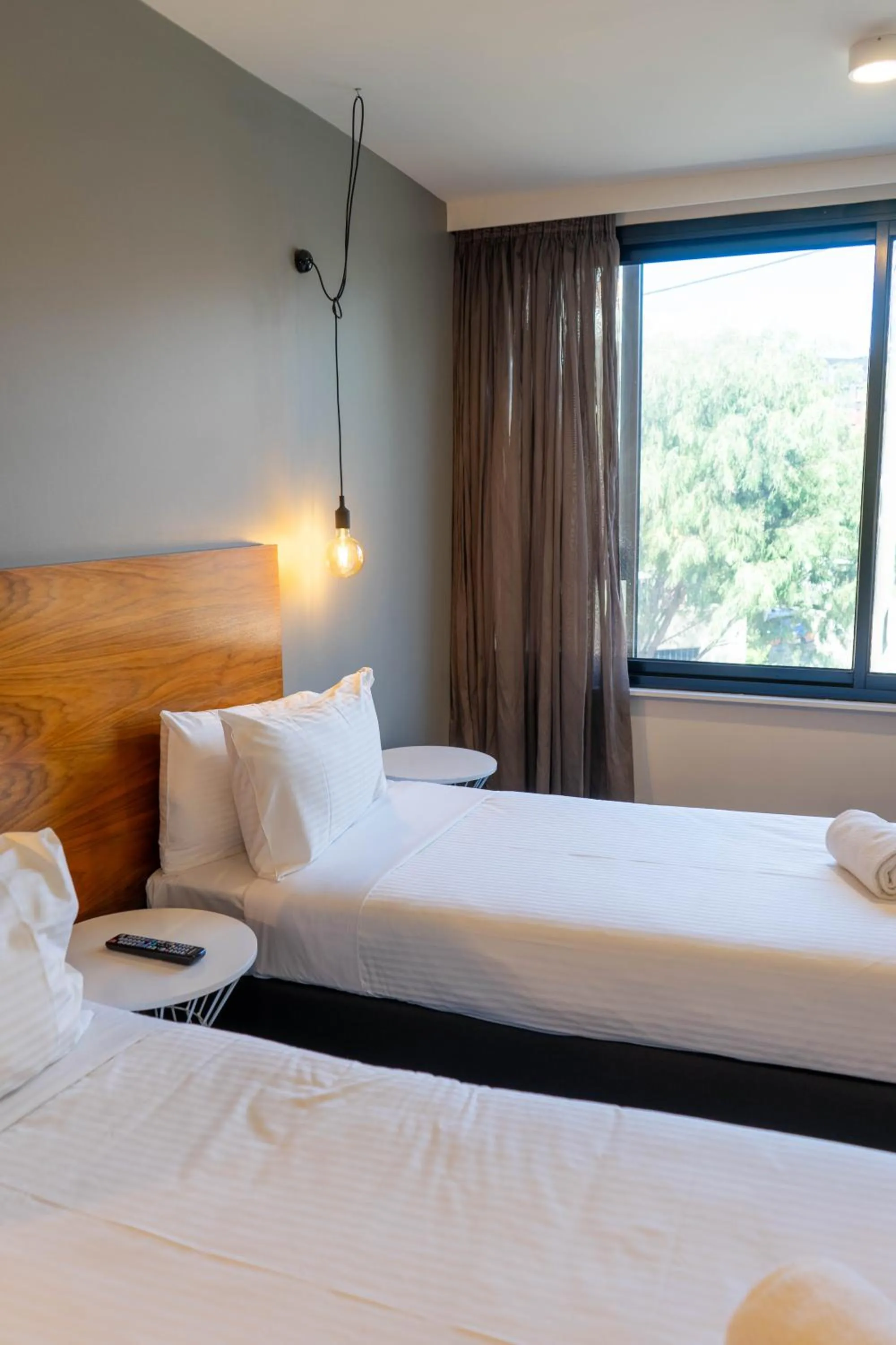 Bed in Cosmopolitan Hotel and Apartments