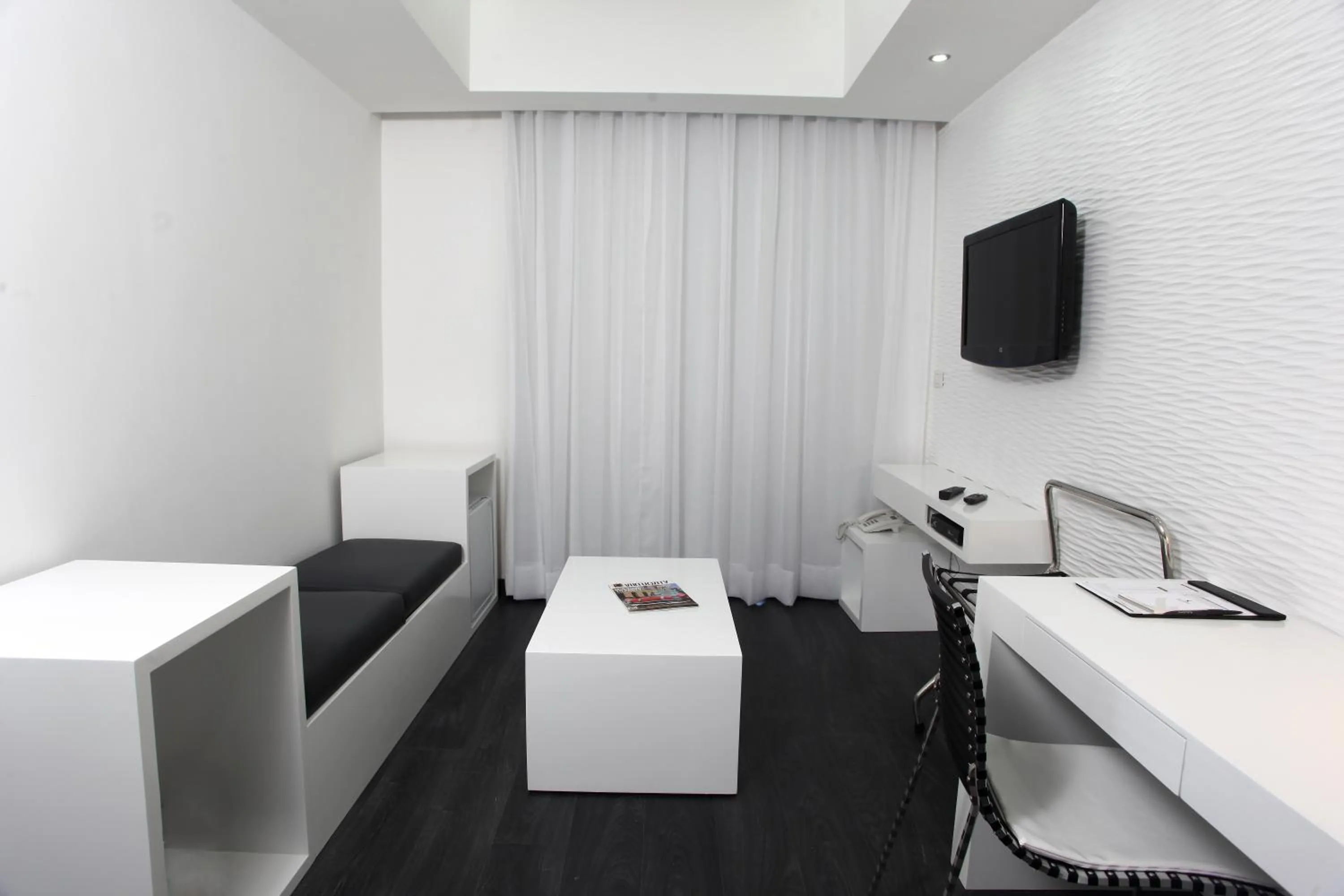 Communal lounge/ TV room in Aleph Boutique Hotel