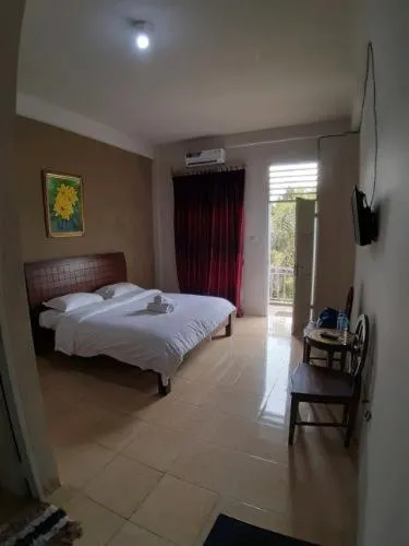 Bed in Tulip Inn Tomohon