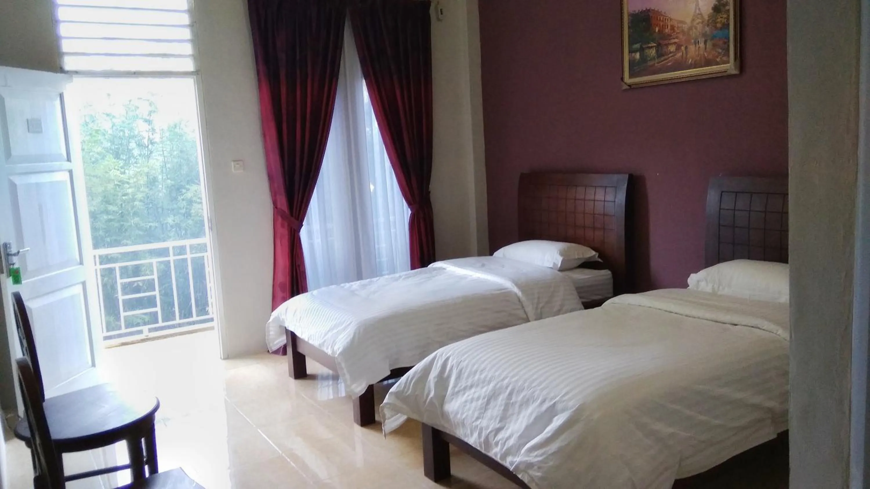 Bed in Tulip Inn Tomohon
