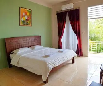 Bed in Tulip Inn Tomohon