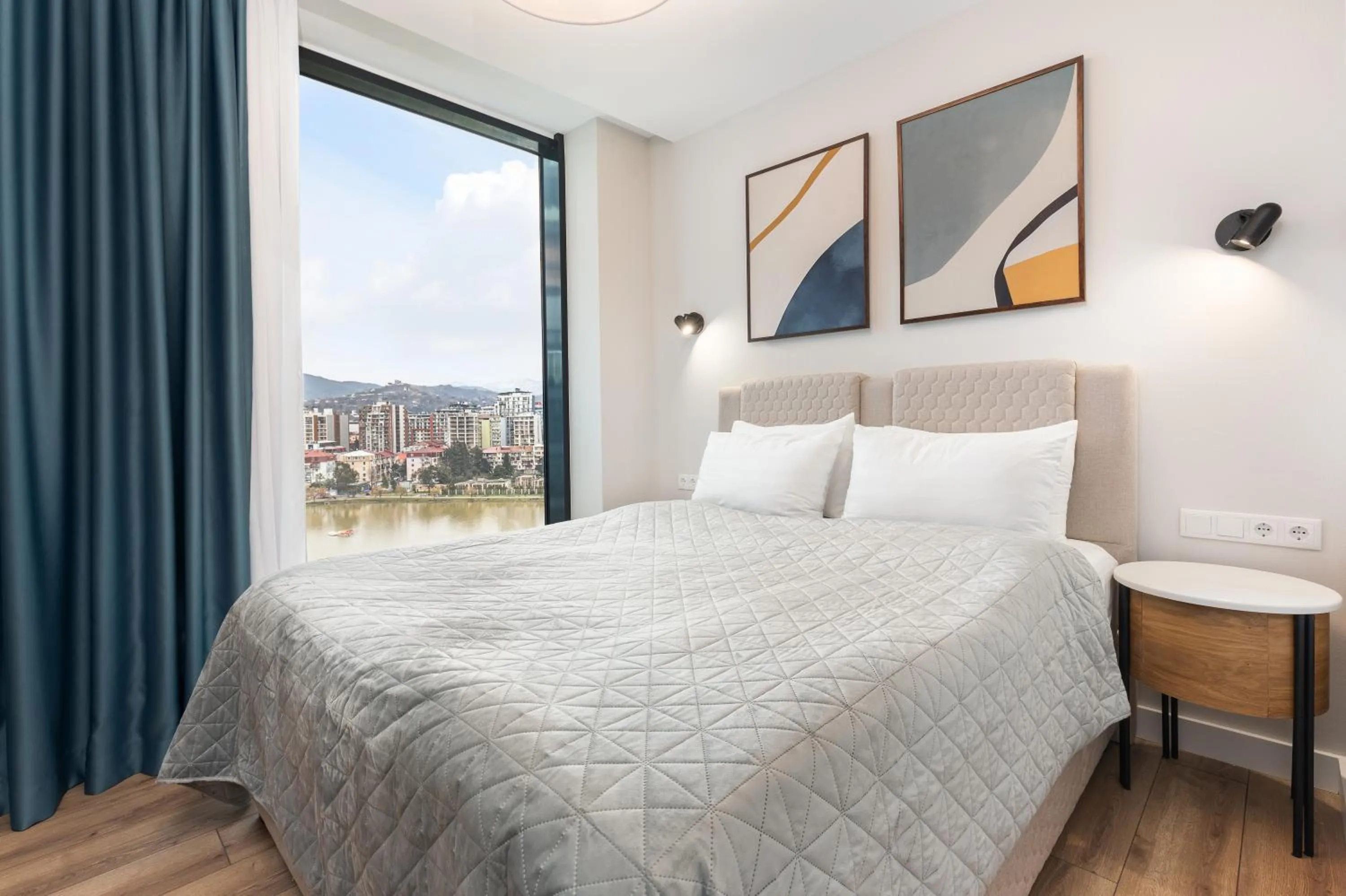 Bed in Bellevue Residence Suites