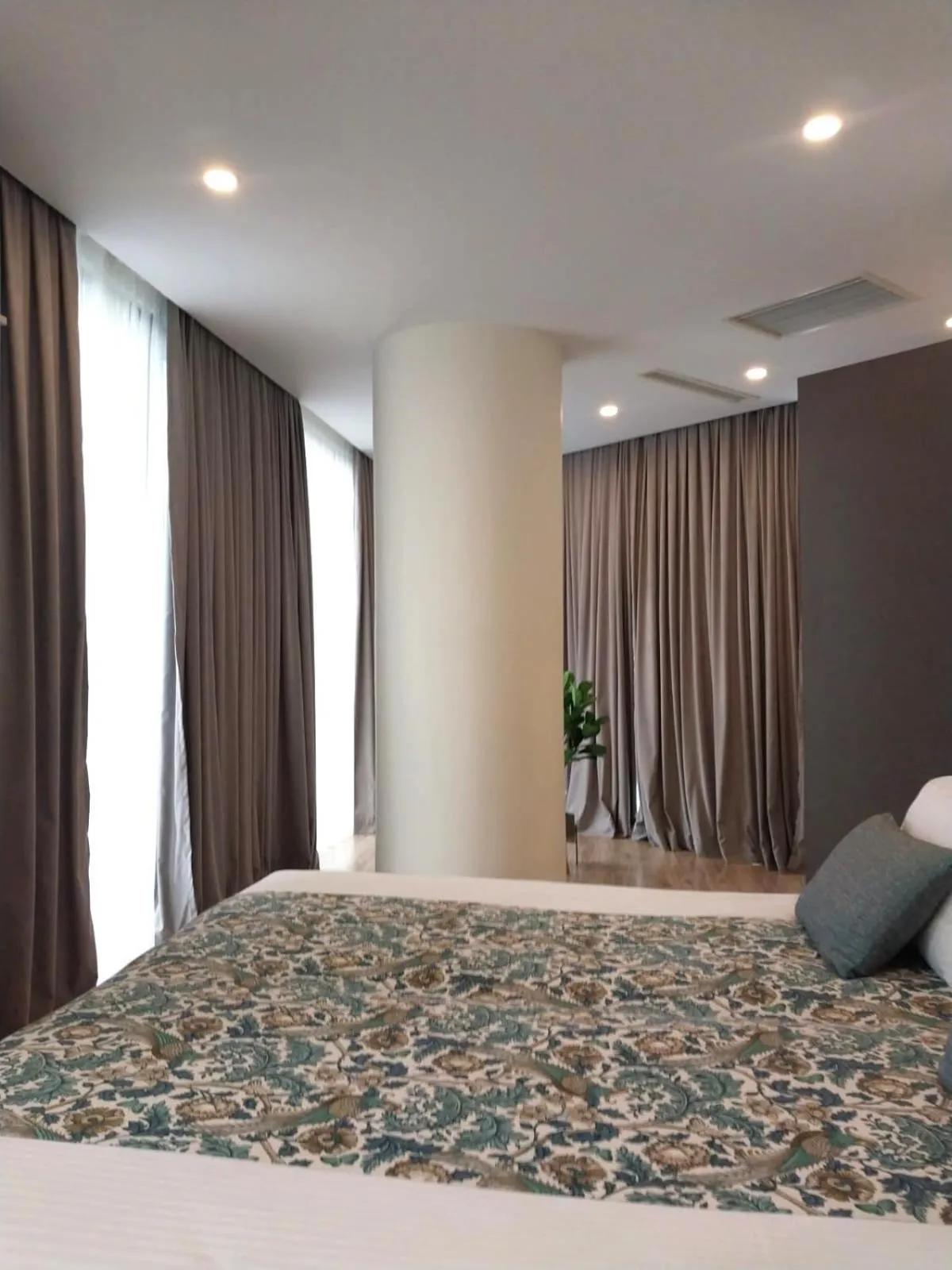 Bed in Bellevue Residence Suites