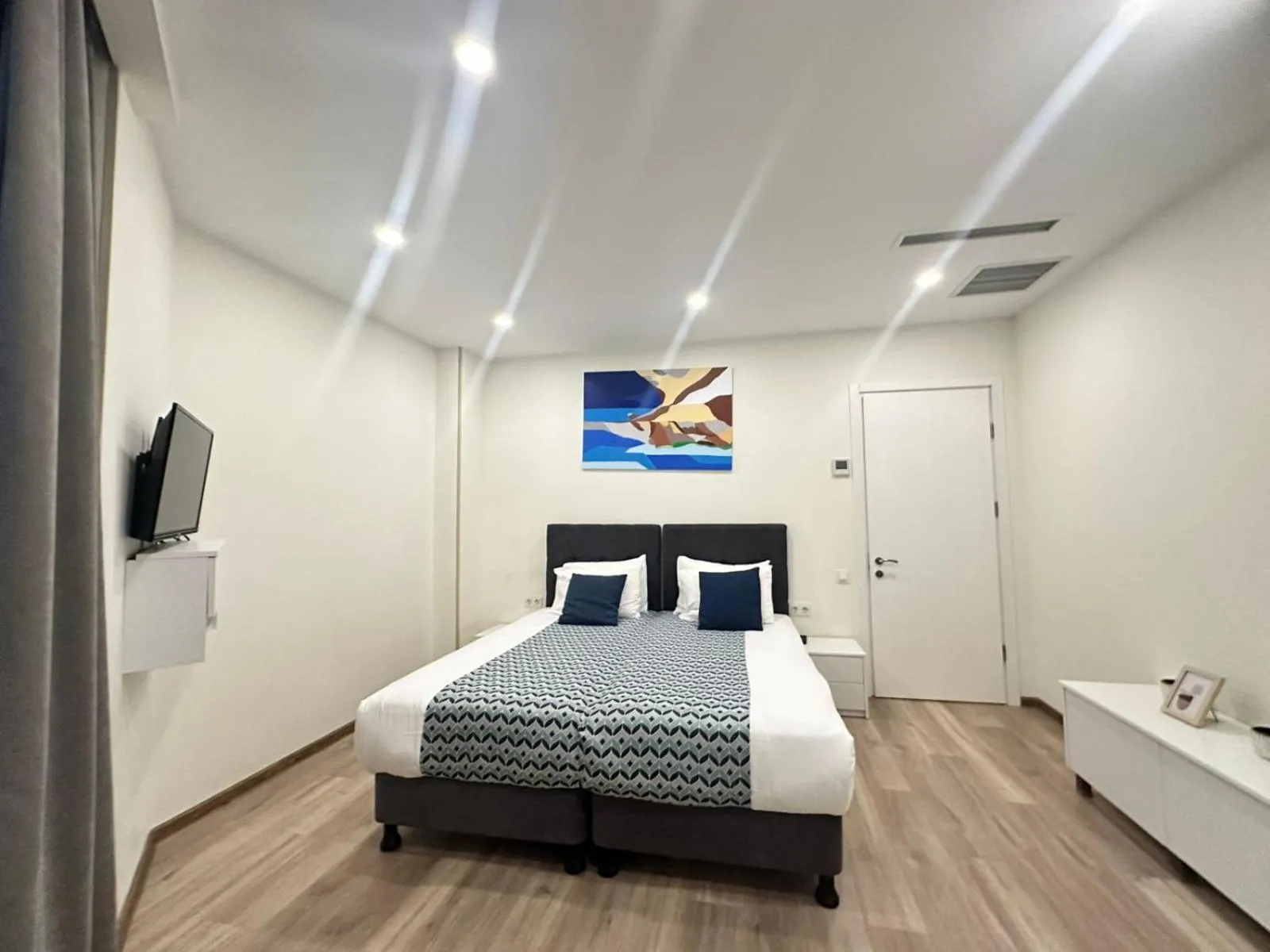 Bed in Bellevue Residence Suites