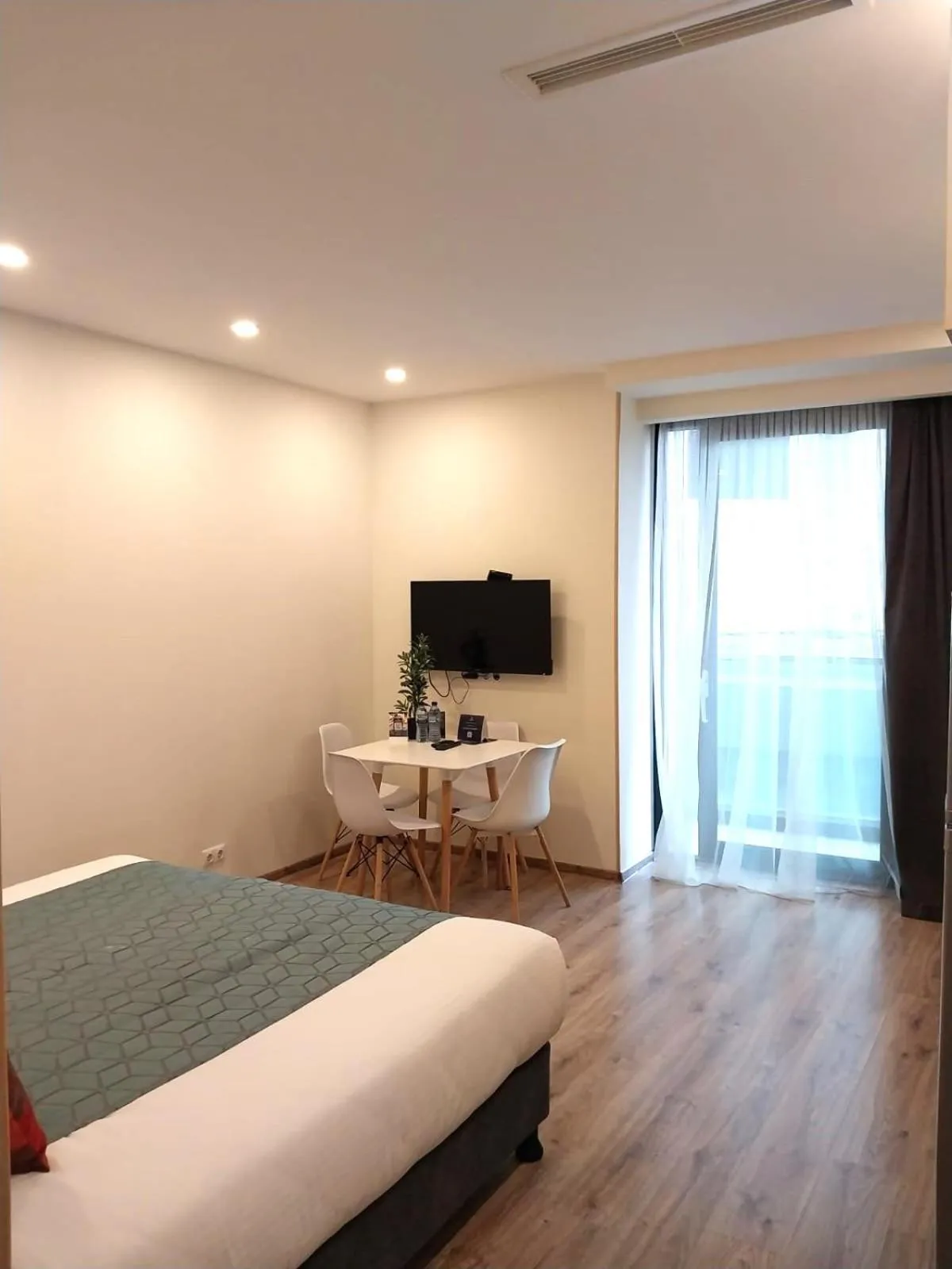 Bed in Bellevue Residence Suites