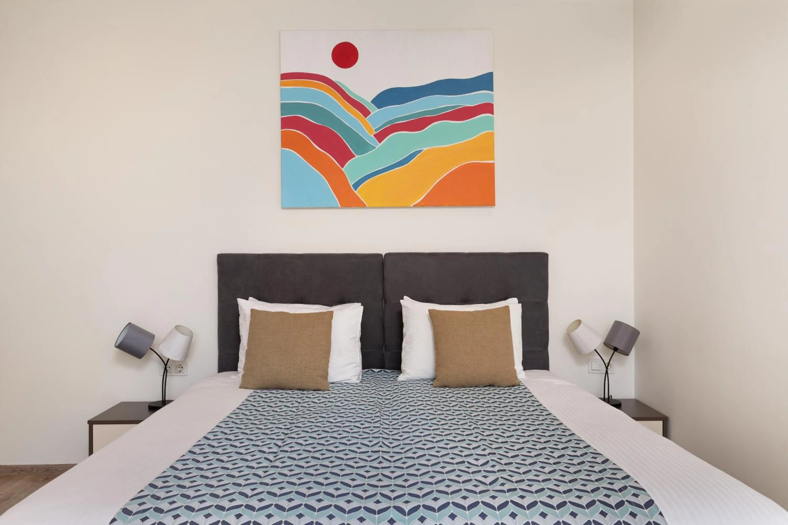 Bed in Bellevue Residence Suites