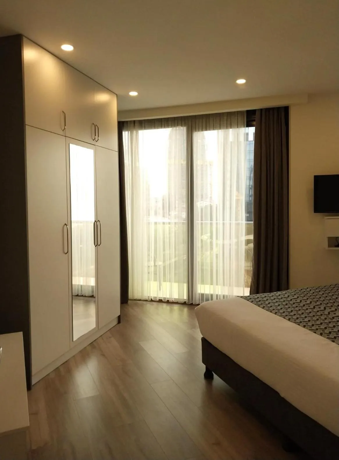 Bed in Bellevue Residence Suites