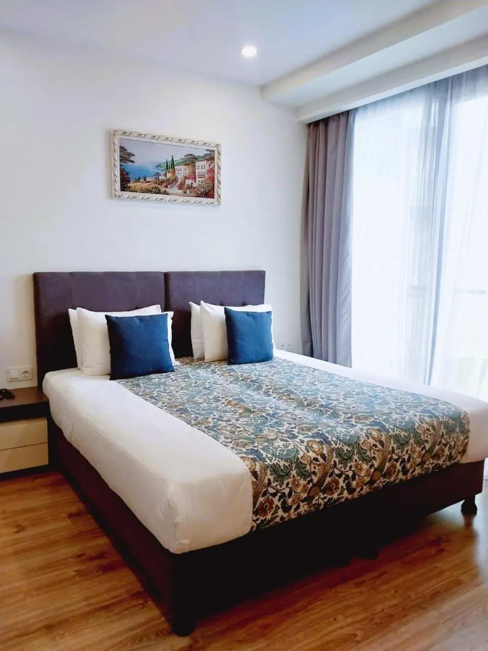 Bed in Bellevue Residence Suites