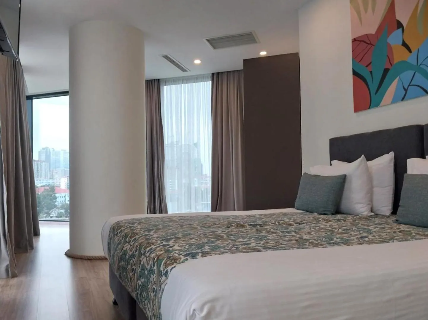 Bed in Bellevue Residence Suites