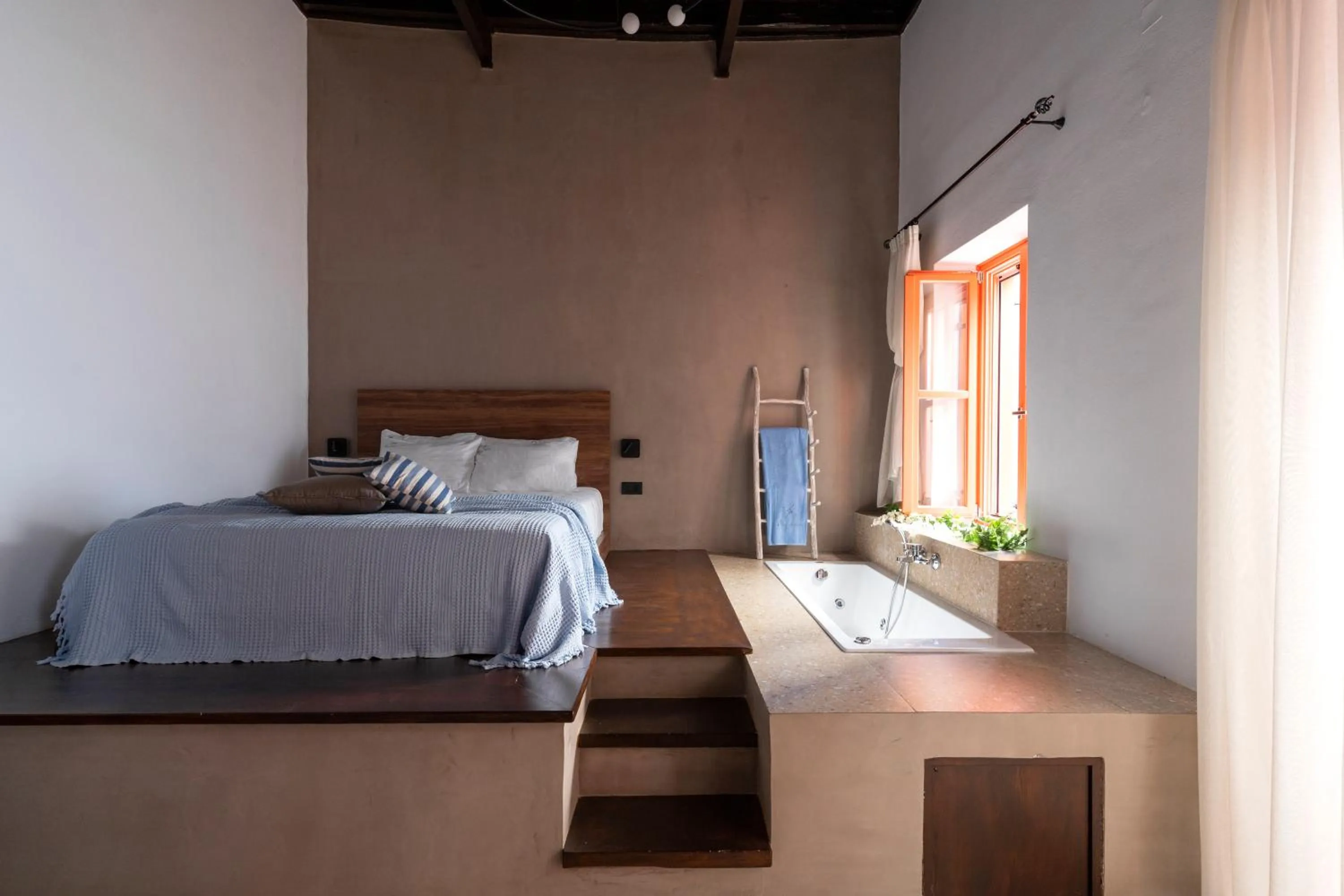 Bedroom in Blue Jasmine Suites