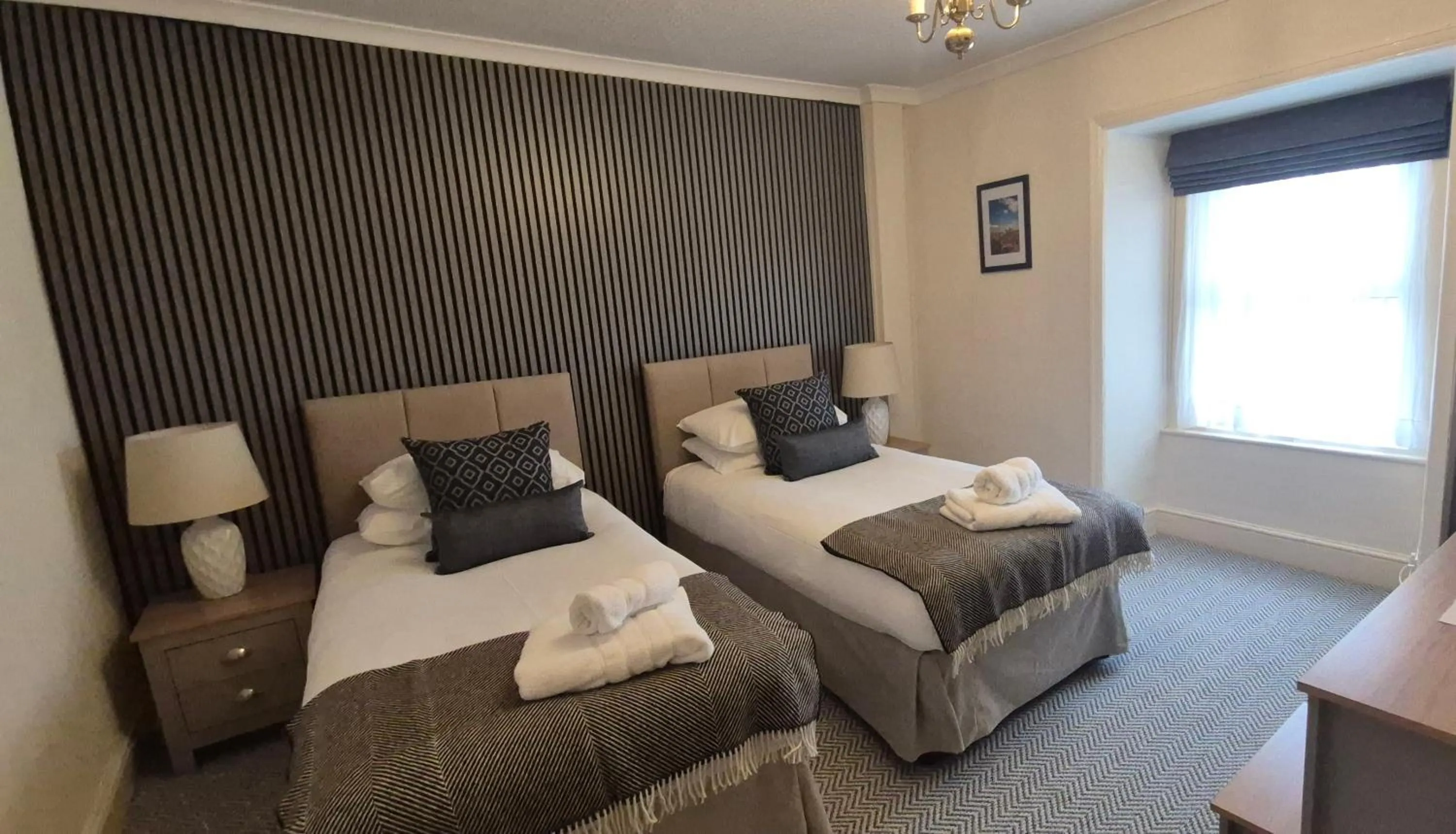 Bed in Royal Sportsman Hotel