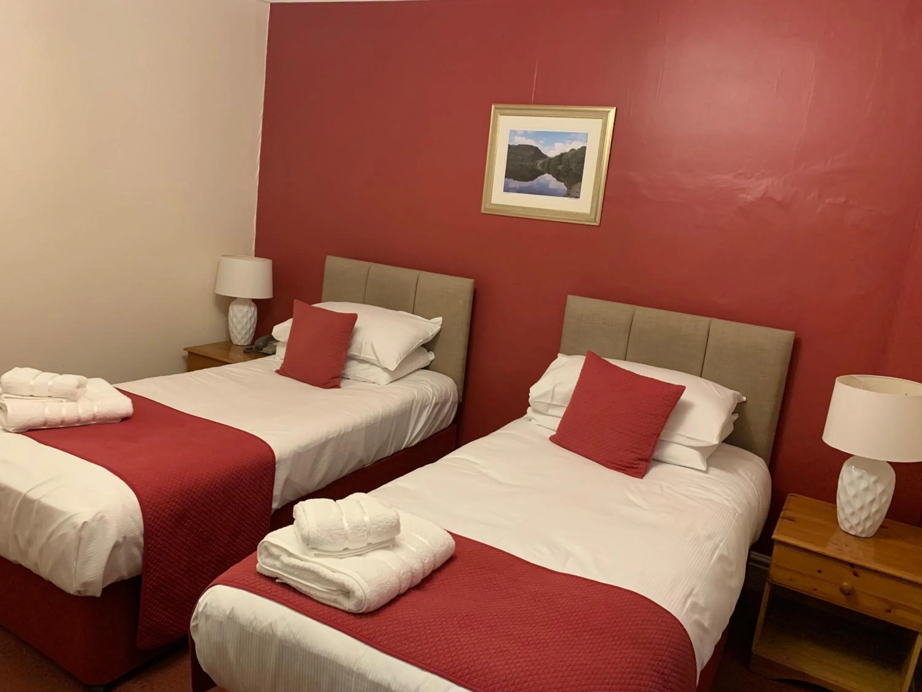 Bed in Royal Sportsman Hotel