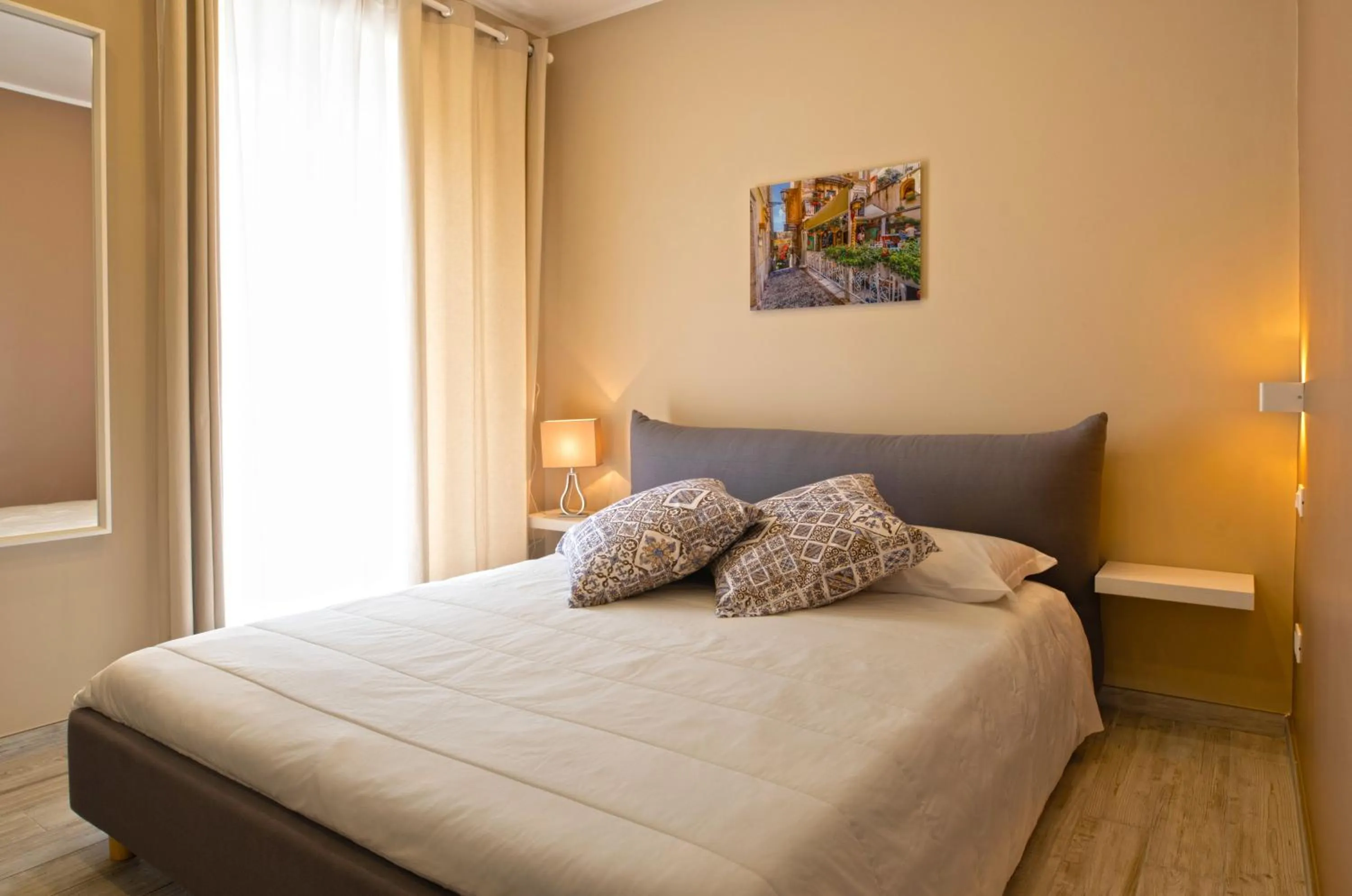 Bed in Taormina Bedda Rooms