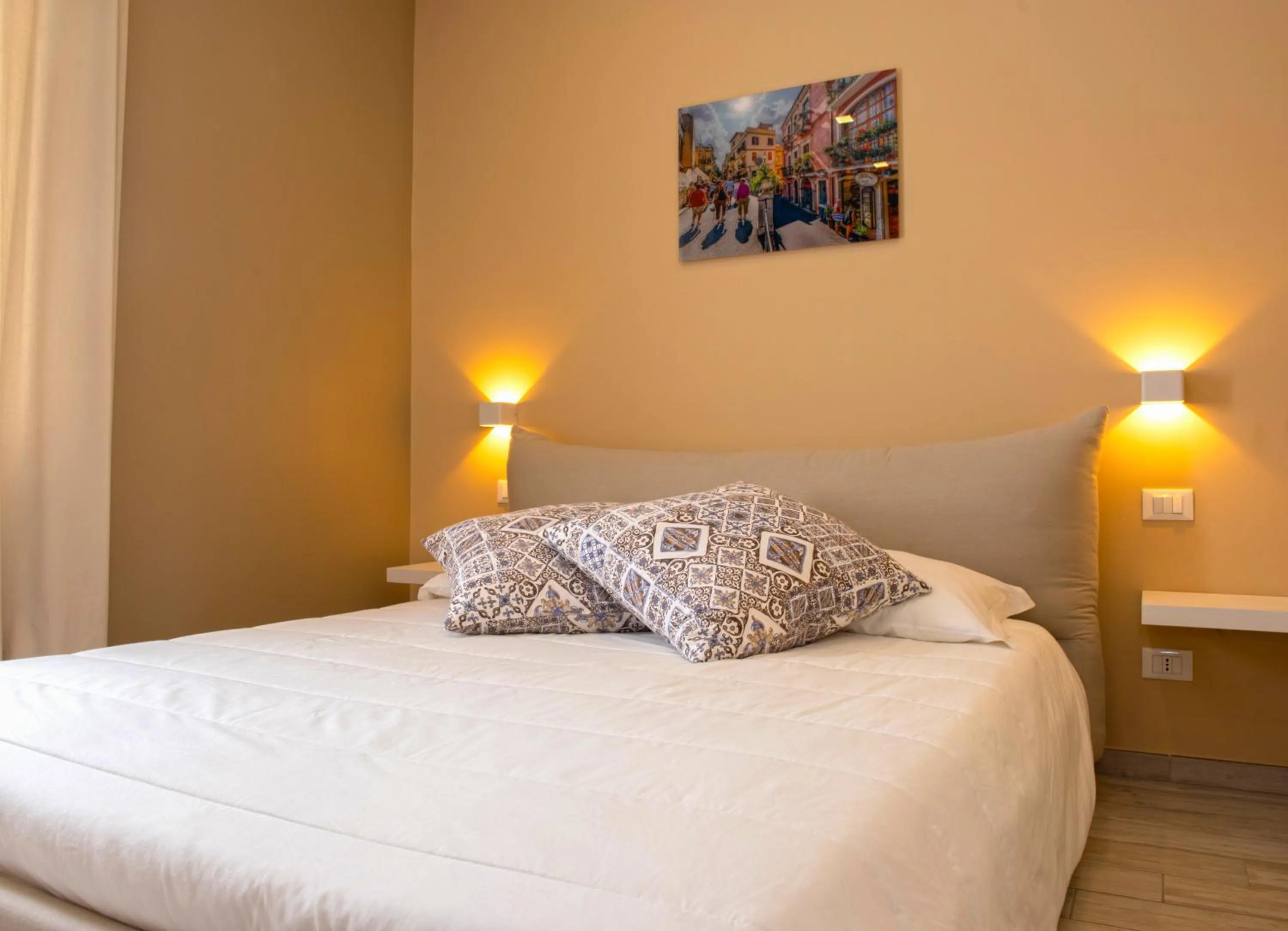 Bed in Taormina Bedda Rooms