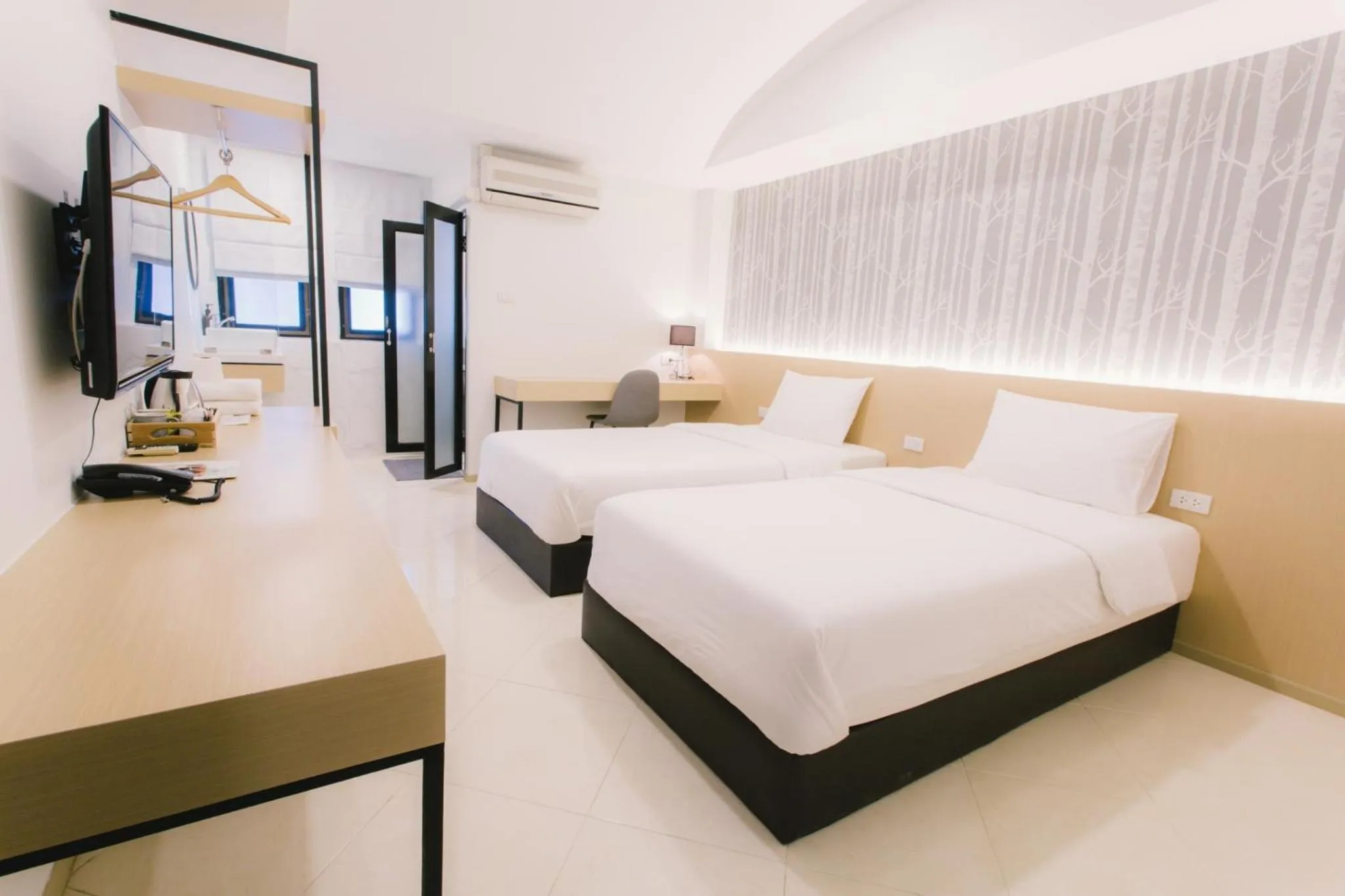 Bed in Royal Princess City Lamphun Hotel