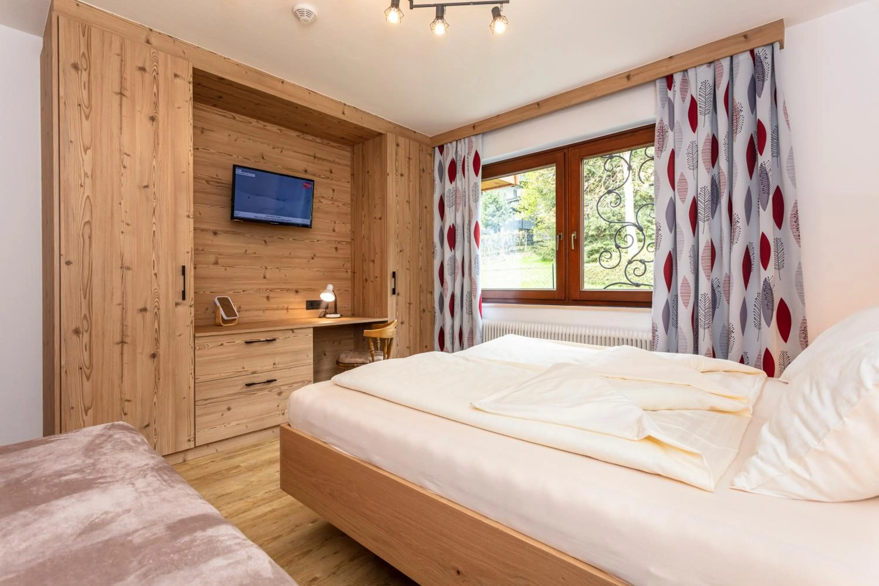 Bed in Hölzl Bed & Breakfast