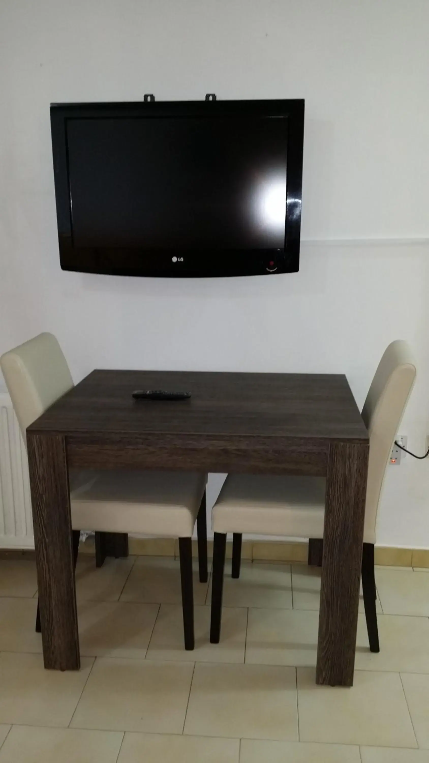 TV and multimedia, TV/Entertainment Center in Agrino Hotel Apartments