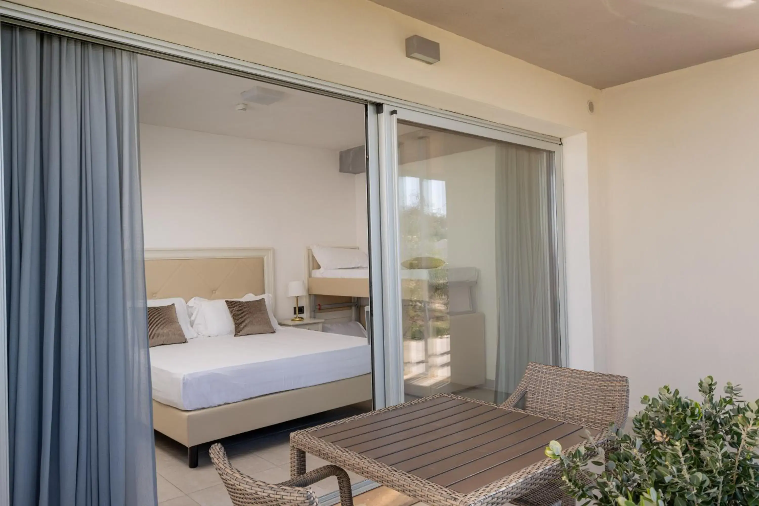 Balcony/Terrace, Bed in Bellevue Sardinia Resort Affiliated by Meliá Balcony/Terrace, Bed in Bellevue Sardinia Resort Affiliated by Meliá