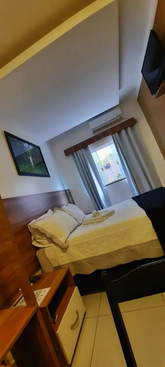 Bed in Pousada Araras