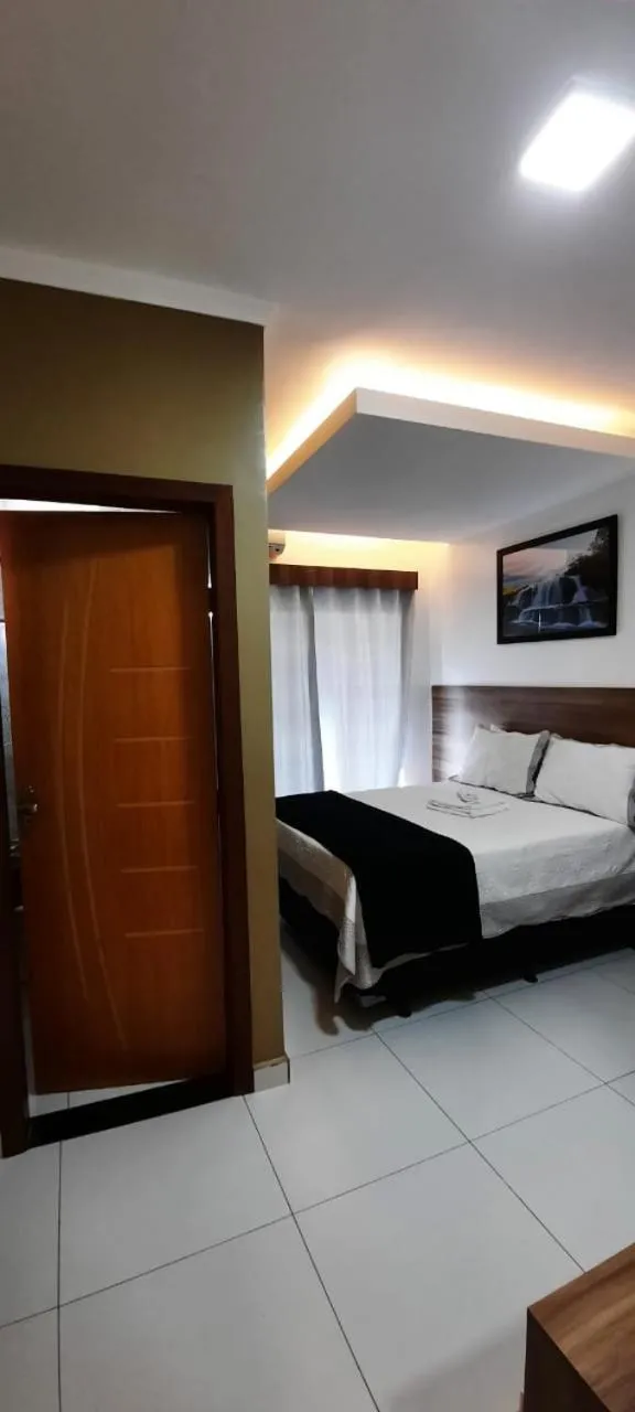 Bed in Pousada Araras