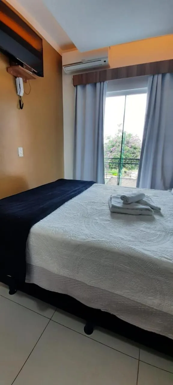 Bed in Pousada Araras