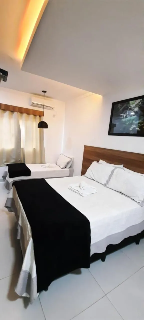 Bed in Pousada Araras