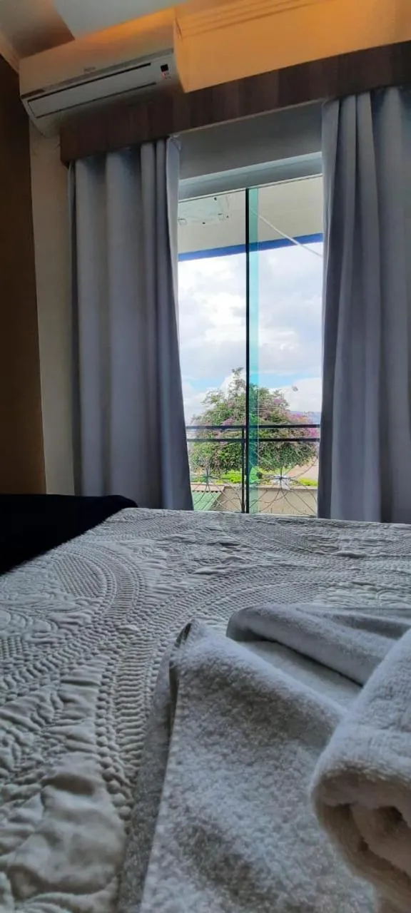 Bed in Pousada Araras