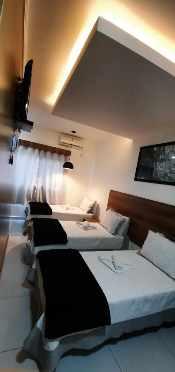 Bed in Pousada Araras