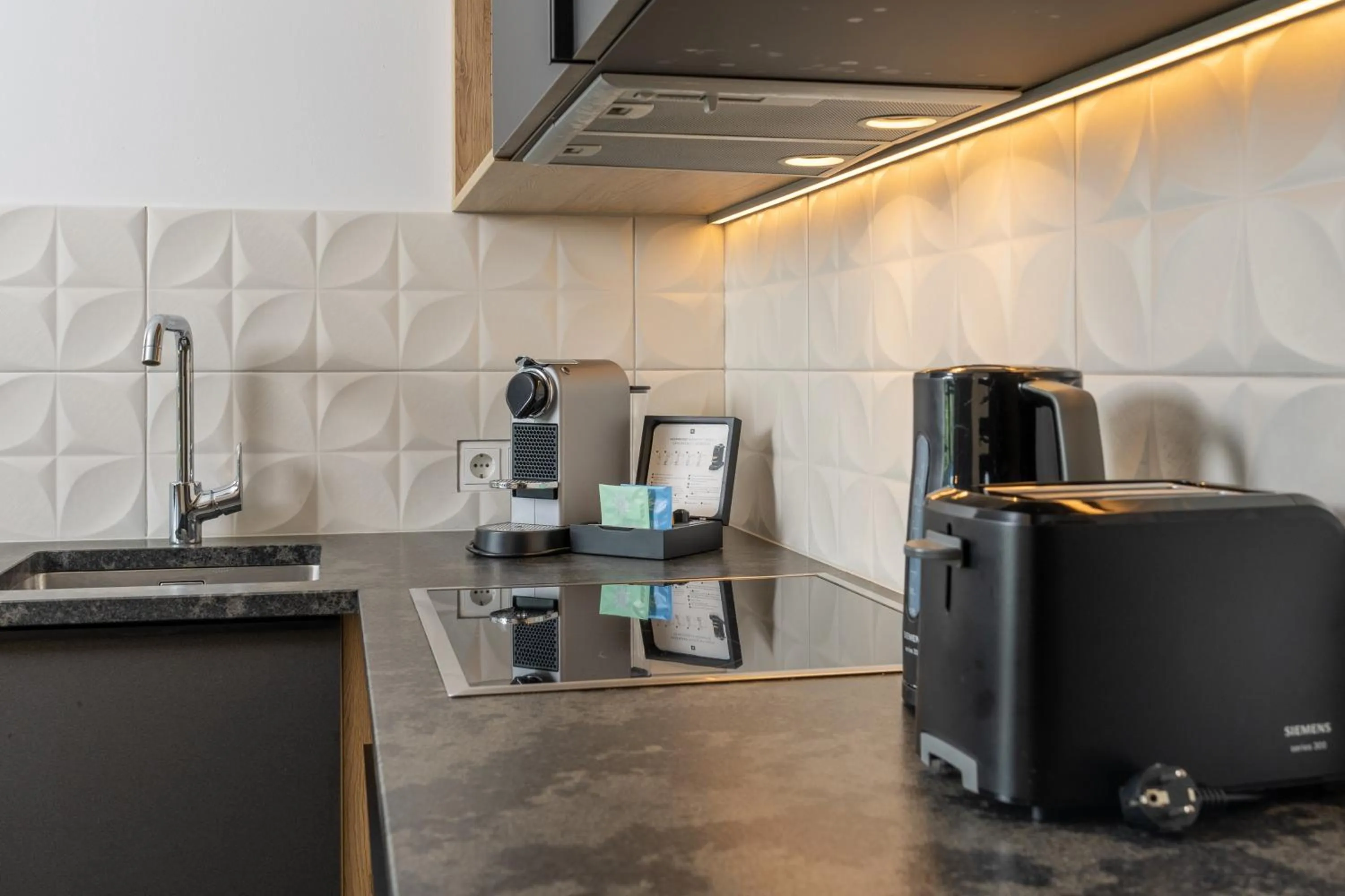 Kitchen or kitchenette in Stockinggut by AvenidA