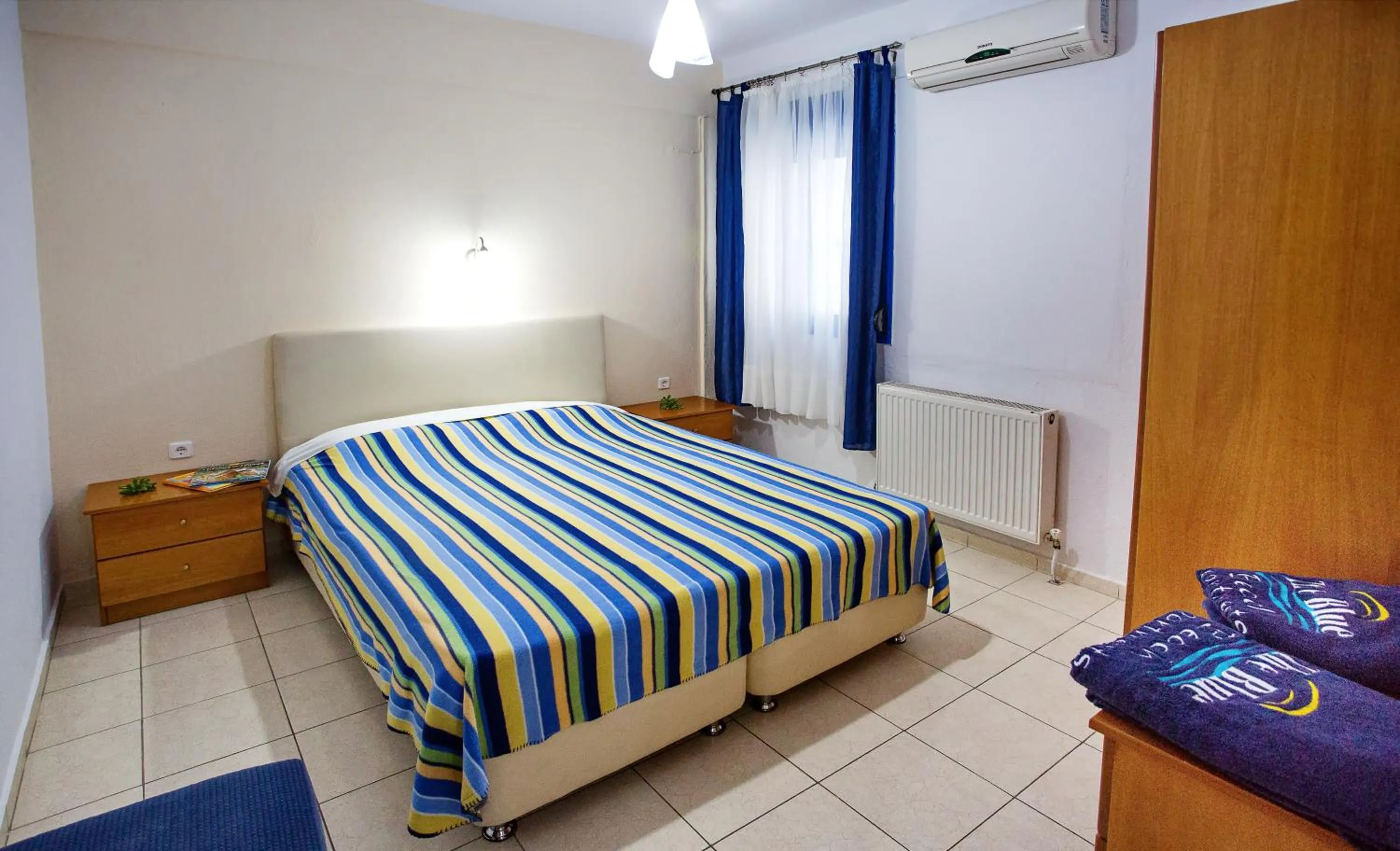 Bed in The Blue Beach Apartments