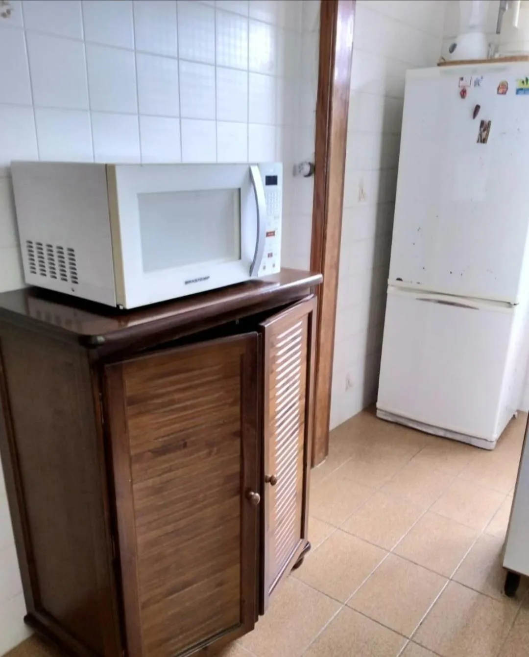 Communal kitchen in Apartamento Campos do Jordao