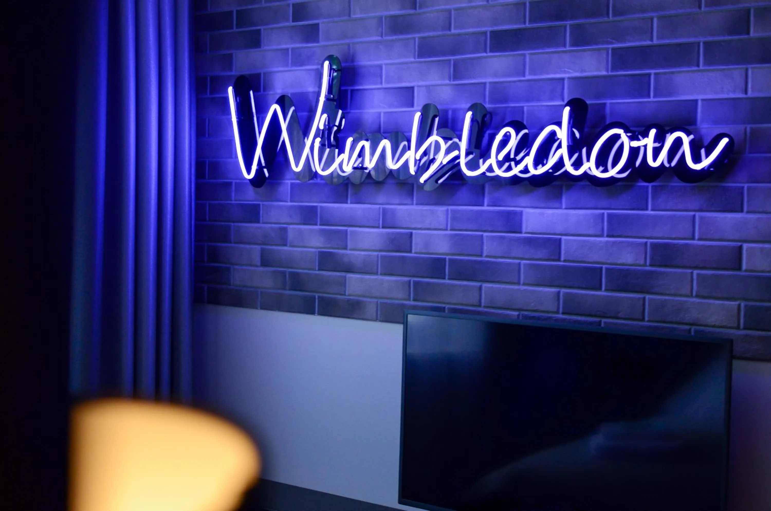 Text overlay in AGA Tenis Apartments by Radwańska