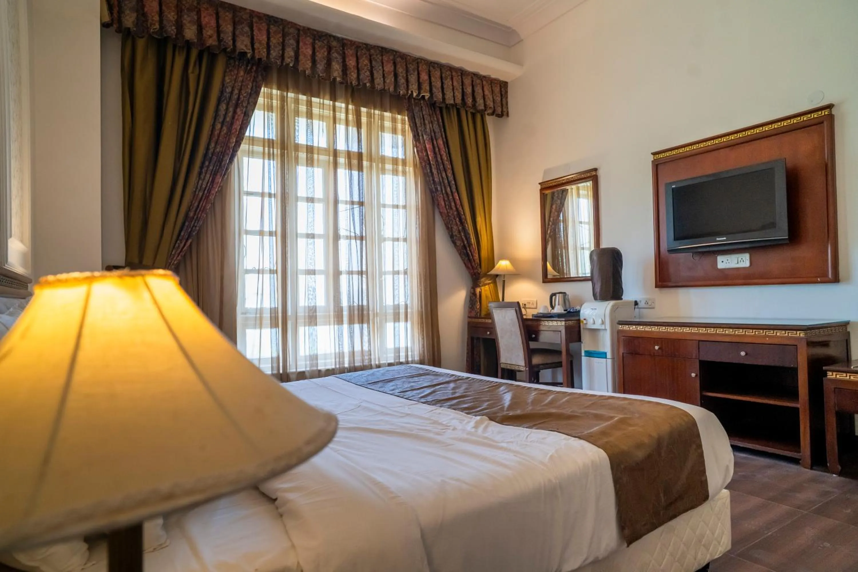 Communal lounge/ TV room, Bed in Hotel Merwara Estate- A Luxury Heritage Resort