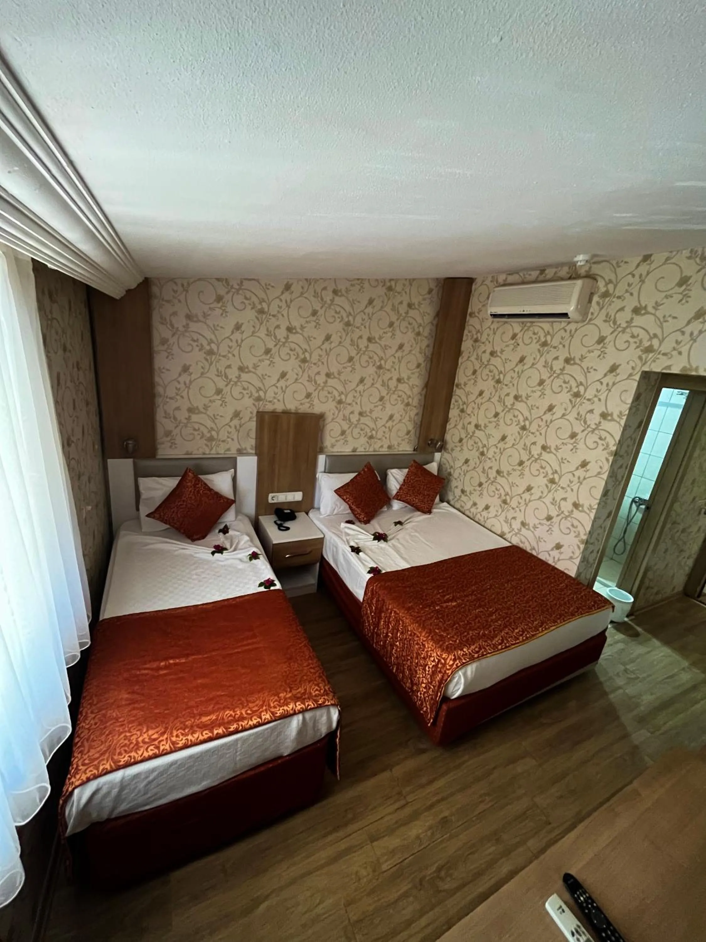 Bed in Aleria Belport Beach Hotel