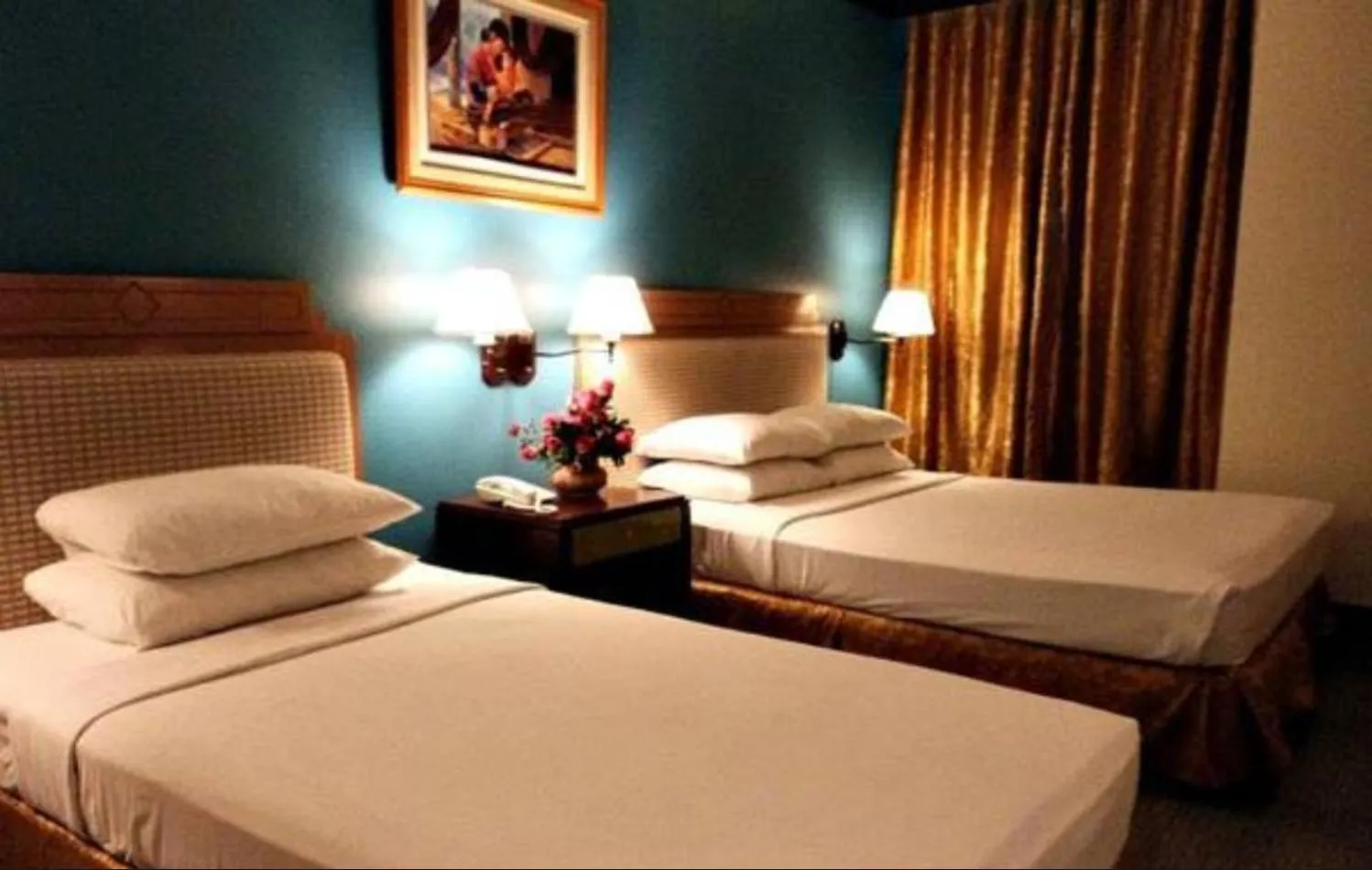 Bed in The Royal Mandaya Hotel