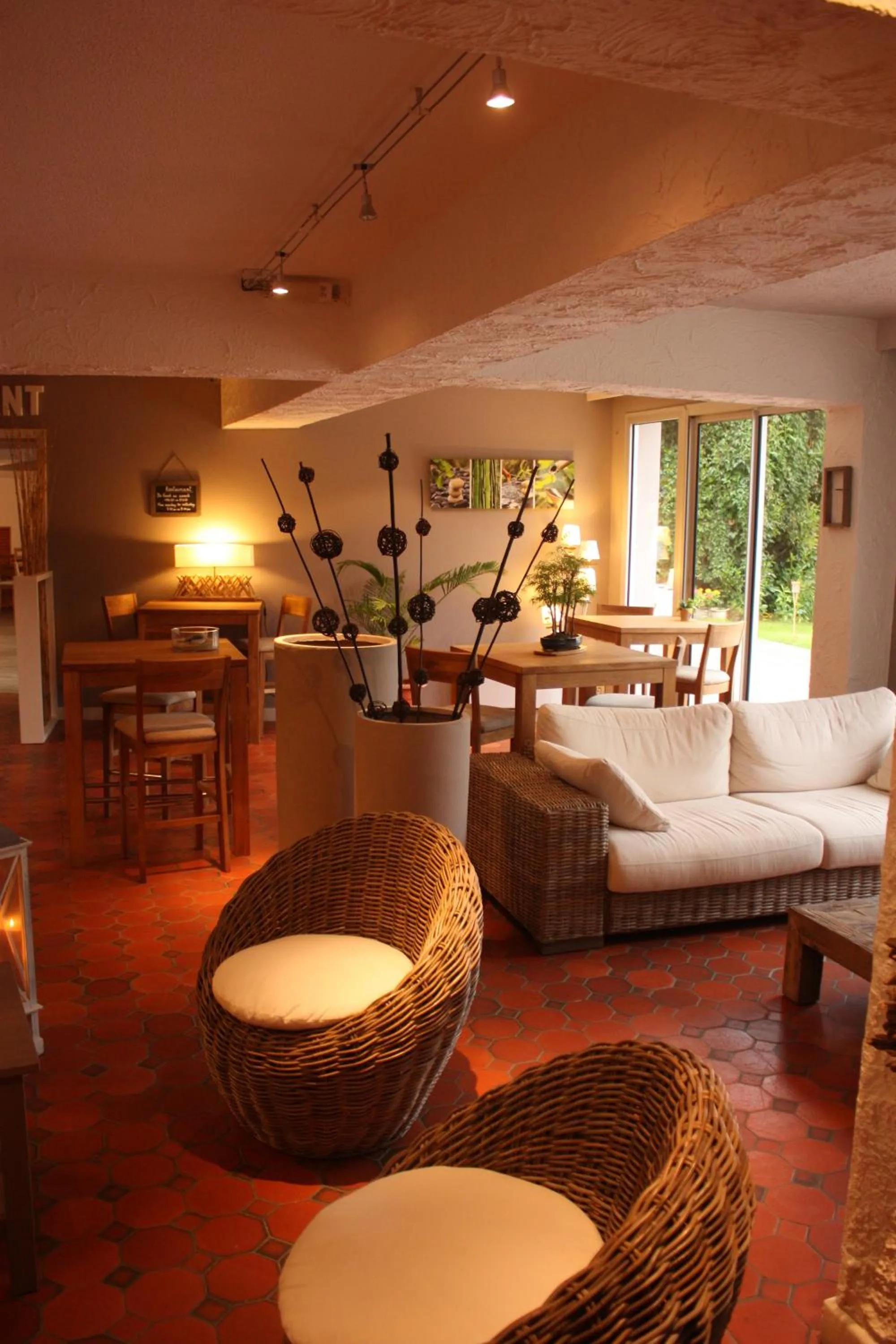 Communal lounge/ TV room in Logis Latitude Ouest Hôtel Restaurant & Spa