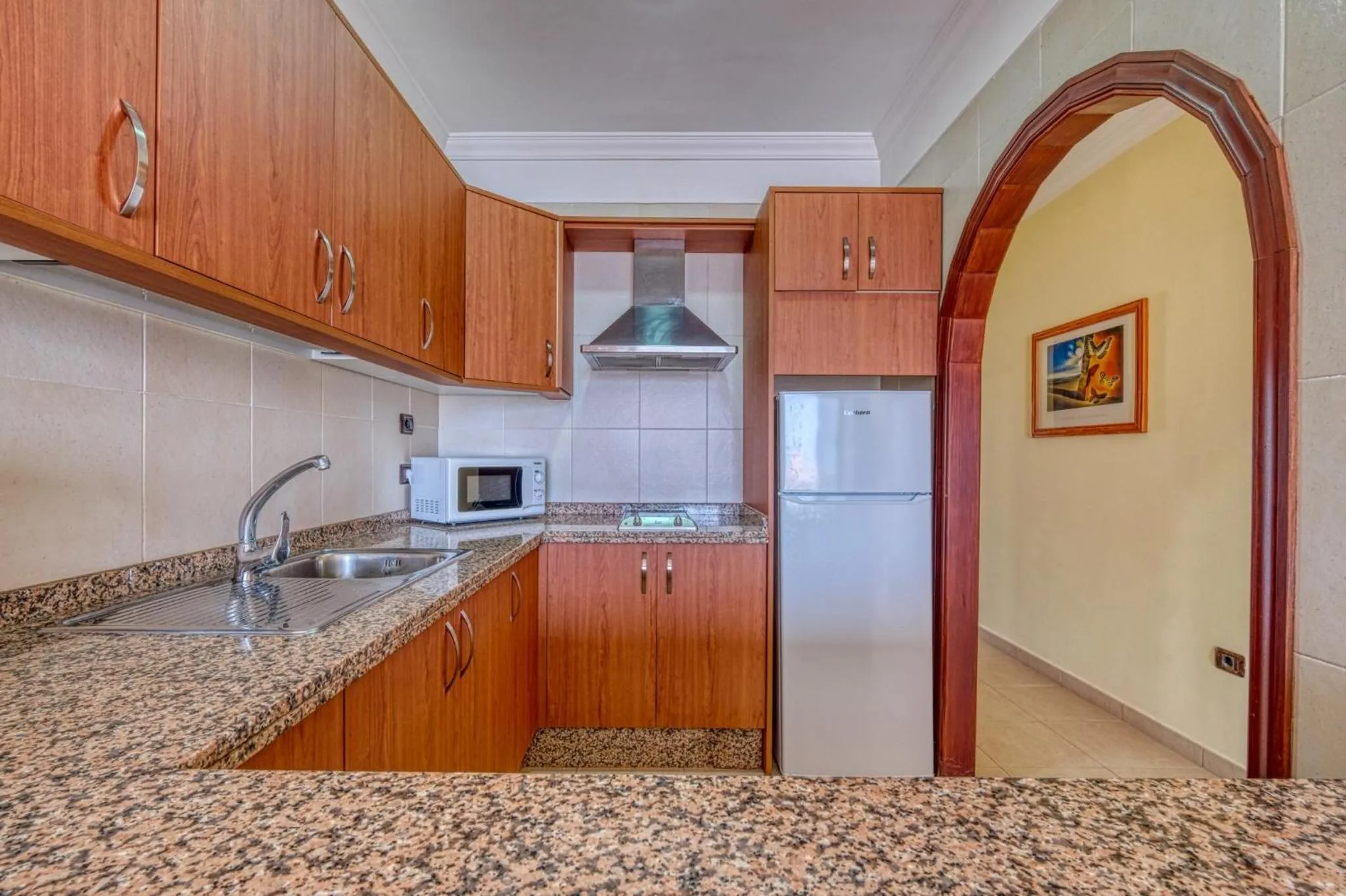 Kitchen or kitchenette in Apartamentos Callaomar